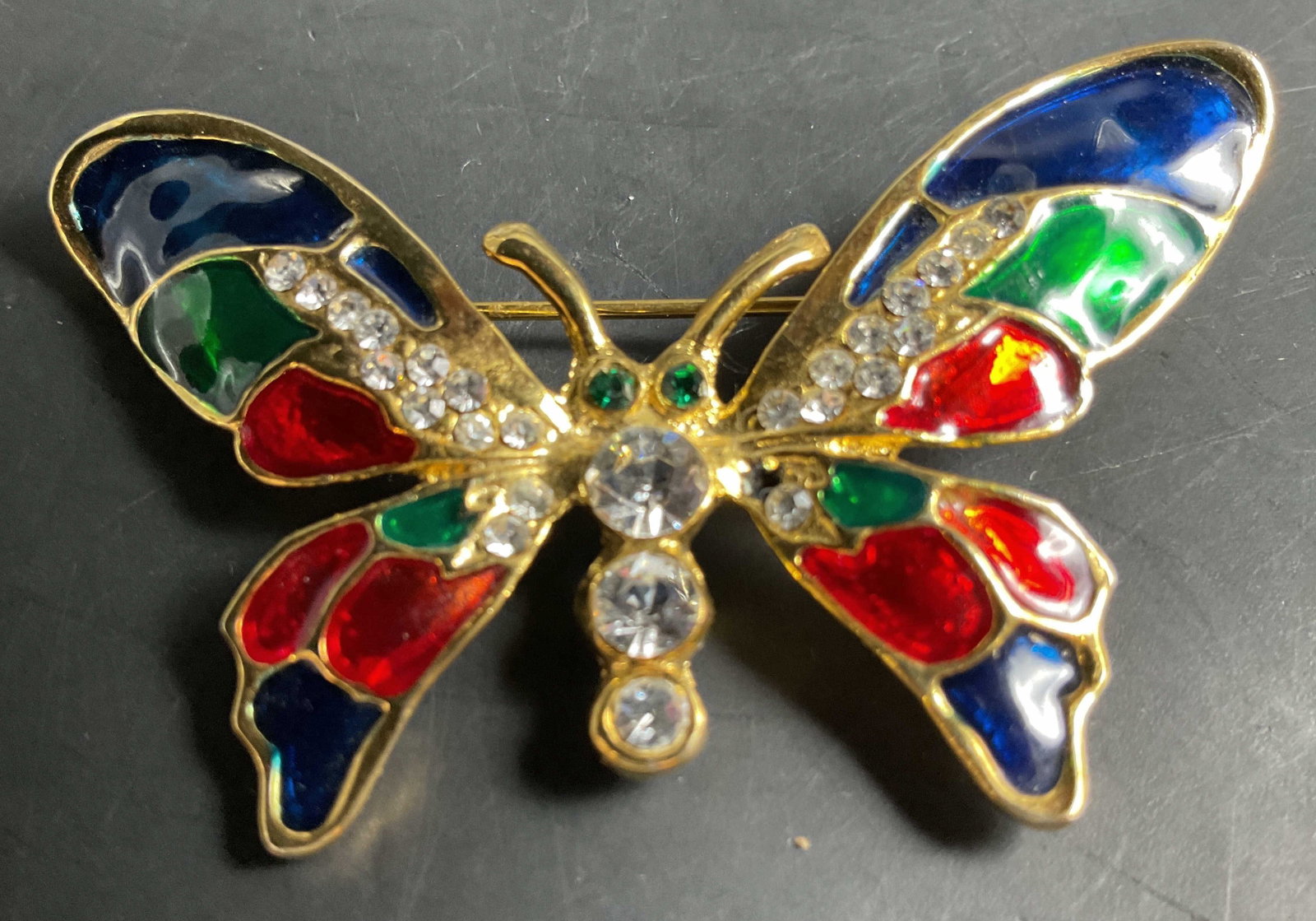 Vntg Gold Tn Rhinestone Butterfly Brooch: Vintage gold tone rhinestone and enamel butterfly brooch, estate jewelry, vintage mid century, bright red, green and blue metallic enamel fills to open work gold tones and rhinestone accents,