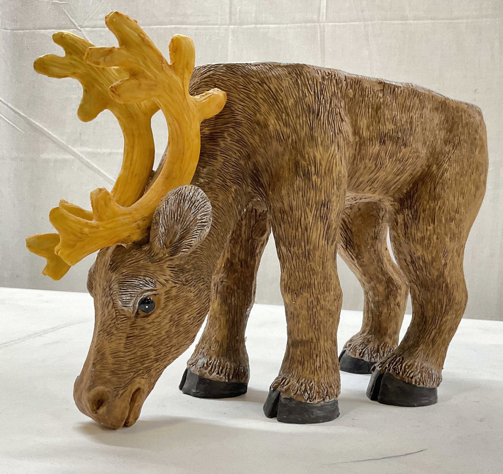 Hand Crafted Wood Moose Textured Stand: Hand crafted Moose / caribou / reindeer figural with textured brown body and yellow antlers flat top as stand, plant stand, stool, or decorative object, heavy resin, measures app ht 9 inches, length