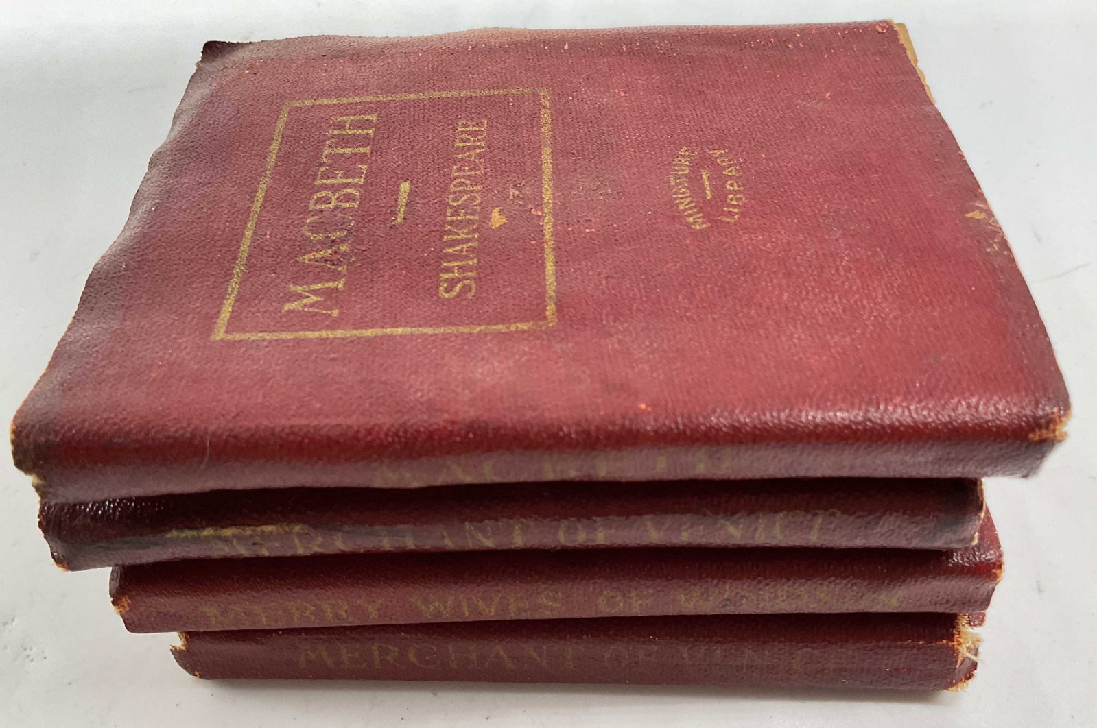 Antique mini Leather Shakespeare set 4: Antique set of mini leather bound Shakespeare plays including merchant of Venice, Merry wives of Windsor, Macbeth, and another merchant of Venice, each measures 4 by 3.25 inches, published by Little L