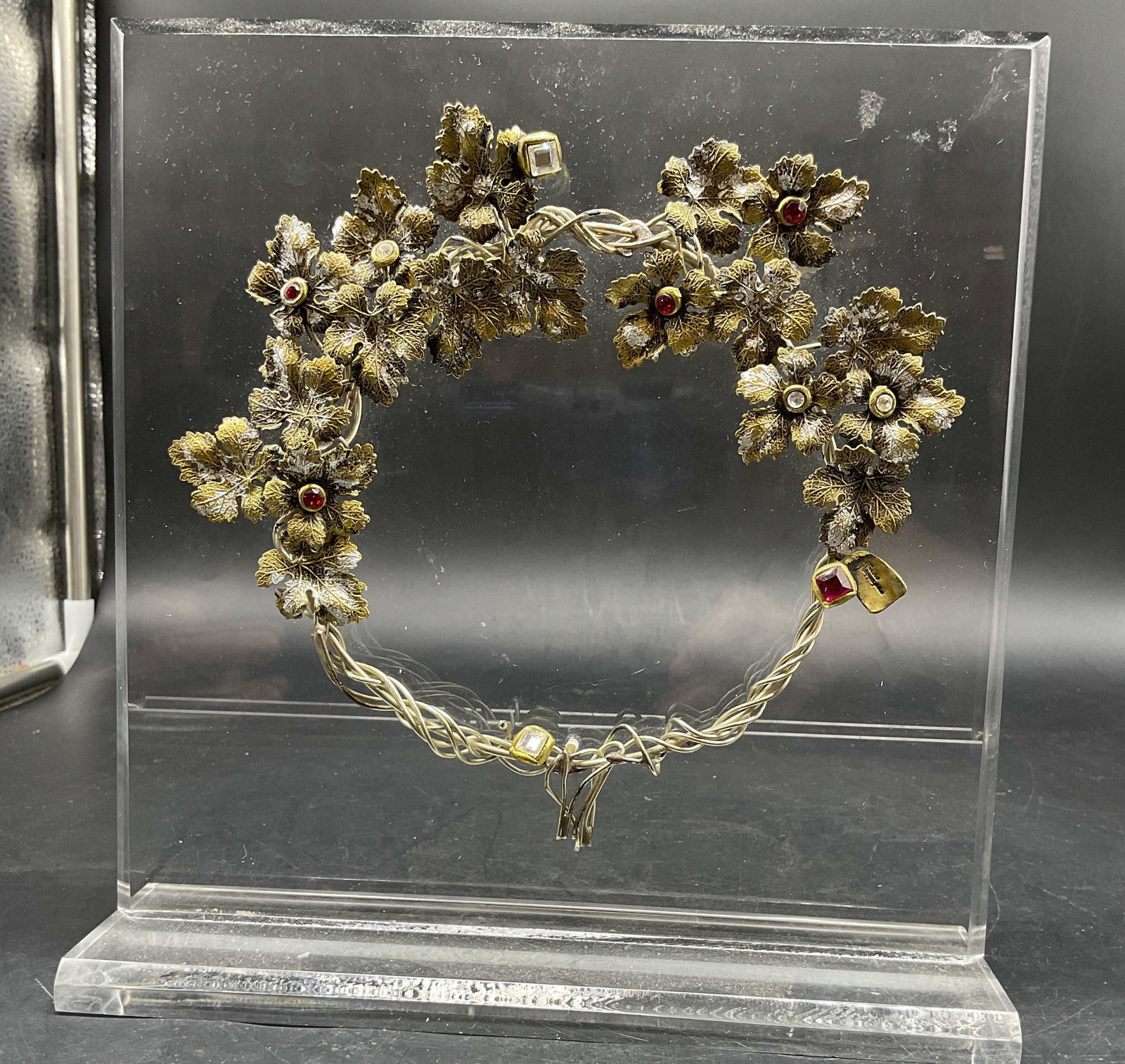 Antq Lucite Mounted Convertible Tiara Necklace: Hand crafted and Mounted on lucite convertible Tiara Necklace featuring an ornate twisted wire frame decorated with detailed gold toned and silver toned metallic leaves and inset gemstone accents, des
