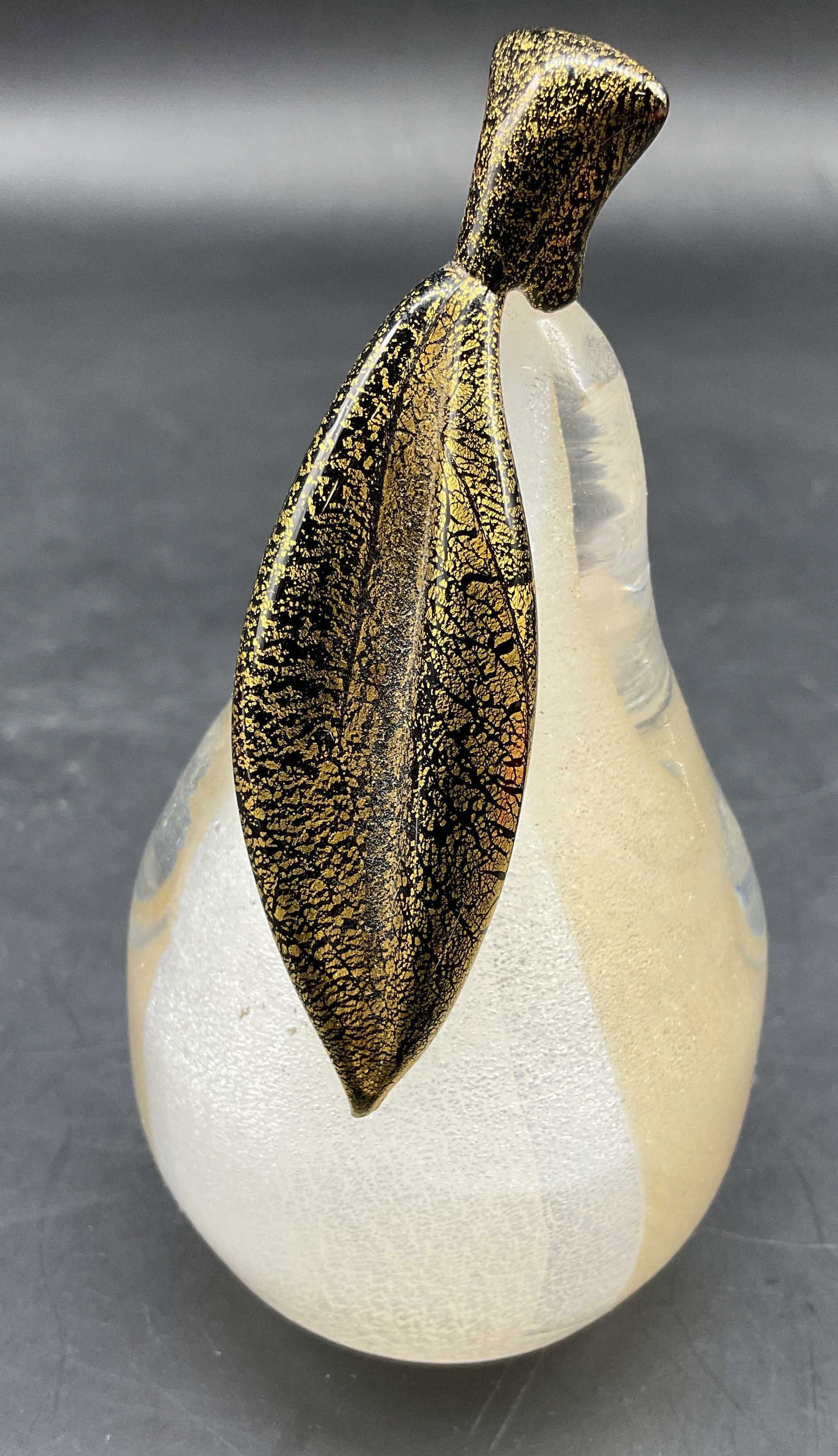 MURANO Art Glass Pear Paperweight: MURANO Art glass pear sculpture paperweight features a frosted shades of white body accented with shimmering gold and copper aventurine flakes along stem and leaf, solid glass, measures ht 4.25 inches