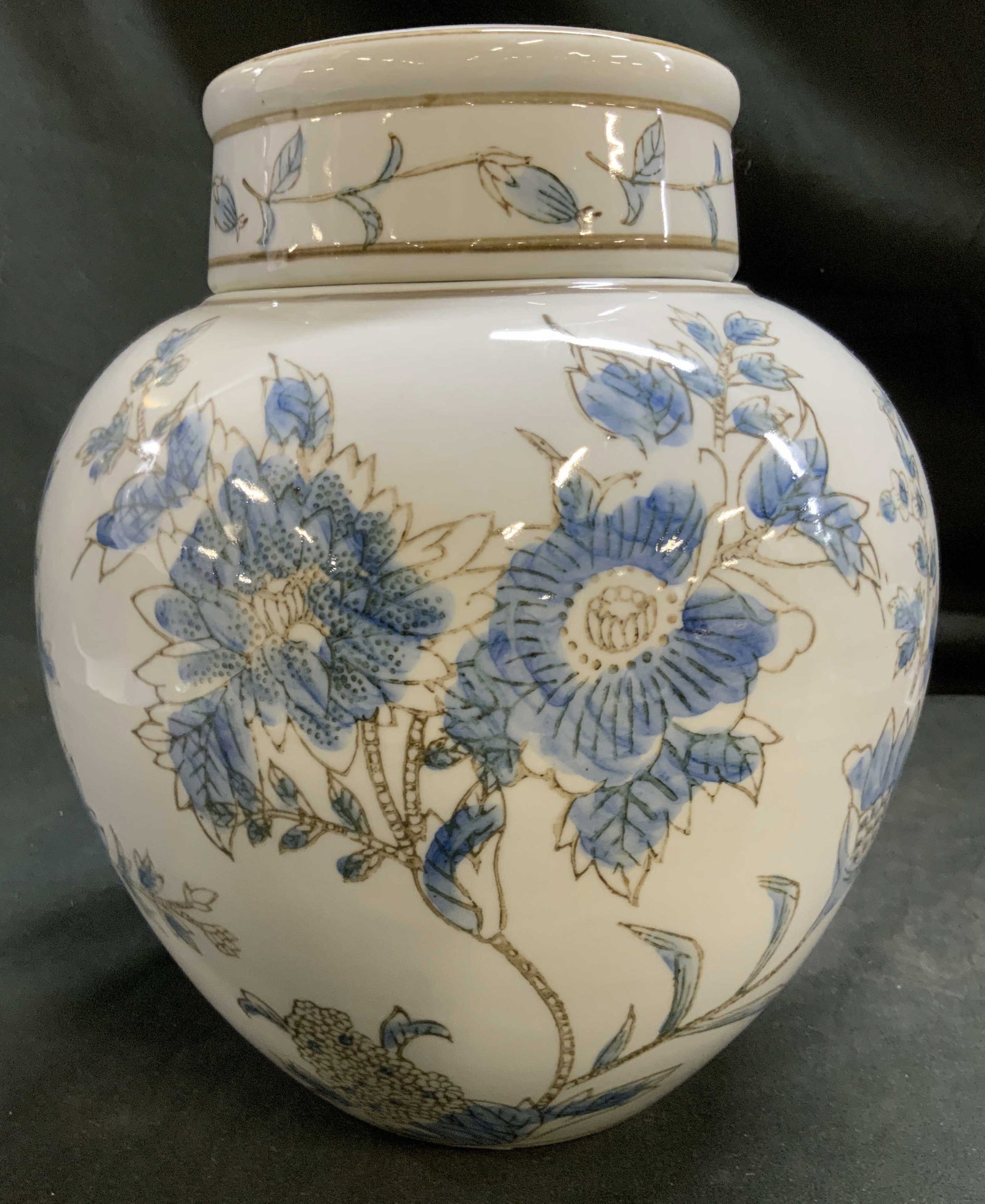 Blue and White Floral Porcelain Ginger Jar: Blue and white flower, hand painted, floral round ginger jar, chinoiserie, light blue and brown sketches of blooming peonies and chrysanthemums set against a polished white porcelain back ground with 