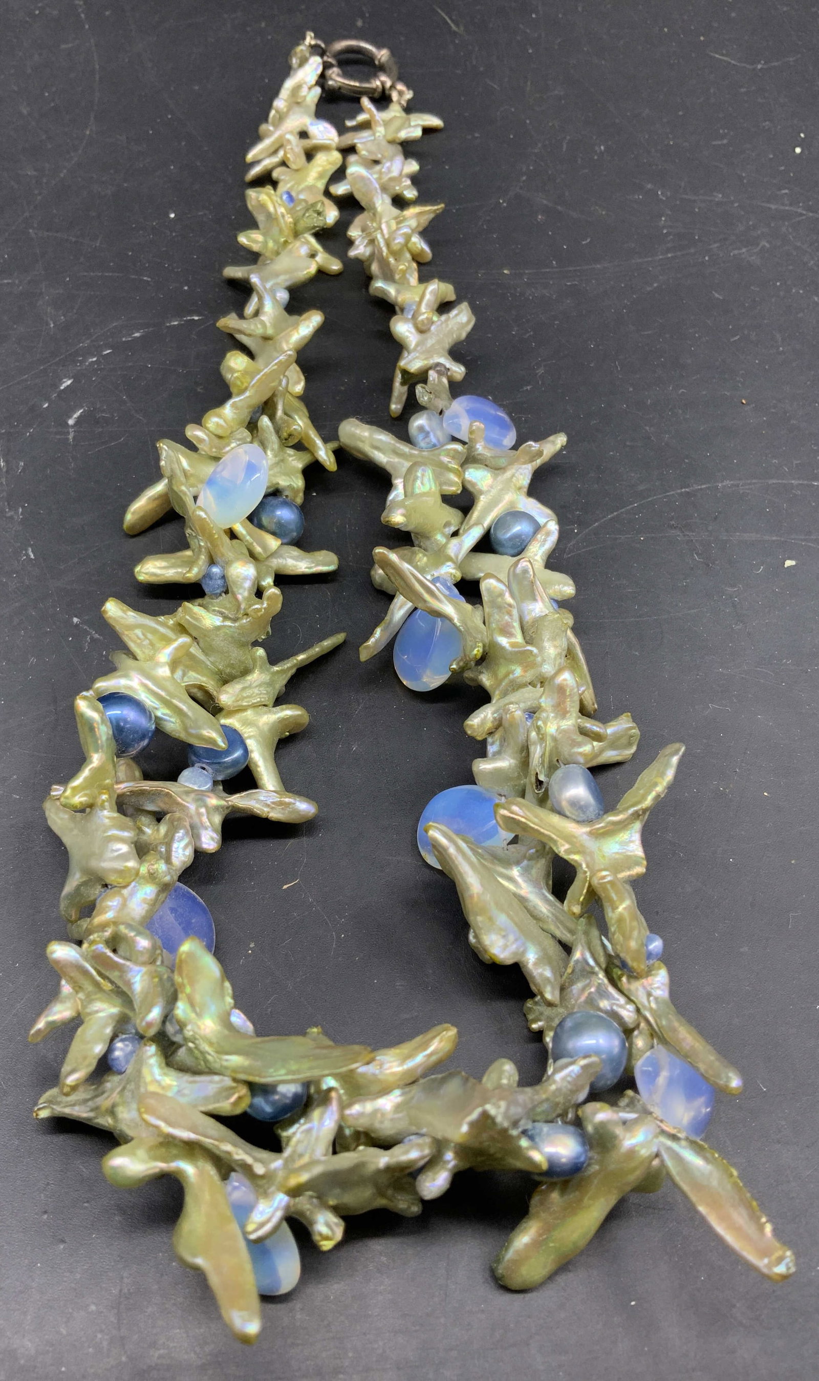 Statement Necklace Baroque Fresh Water Pearls: Statement necklace featuring cross baroque freshwater thorn or branch like pearls paired with moonstone cabochons and shimmering metallic blue pearls, branch pearls, branch pearls silver clasp,
