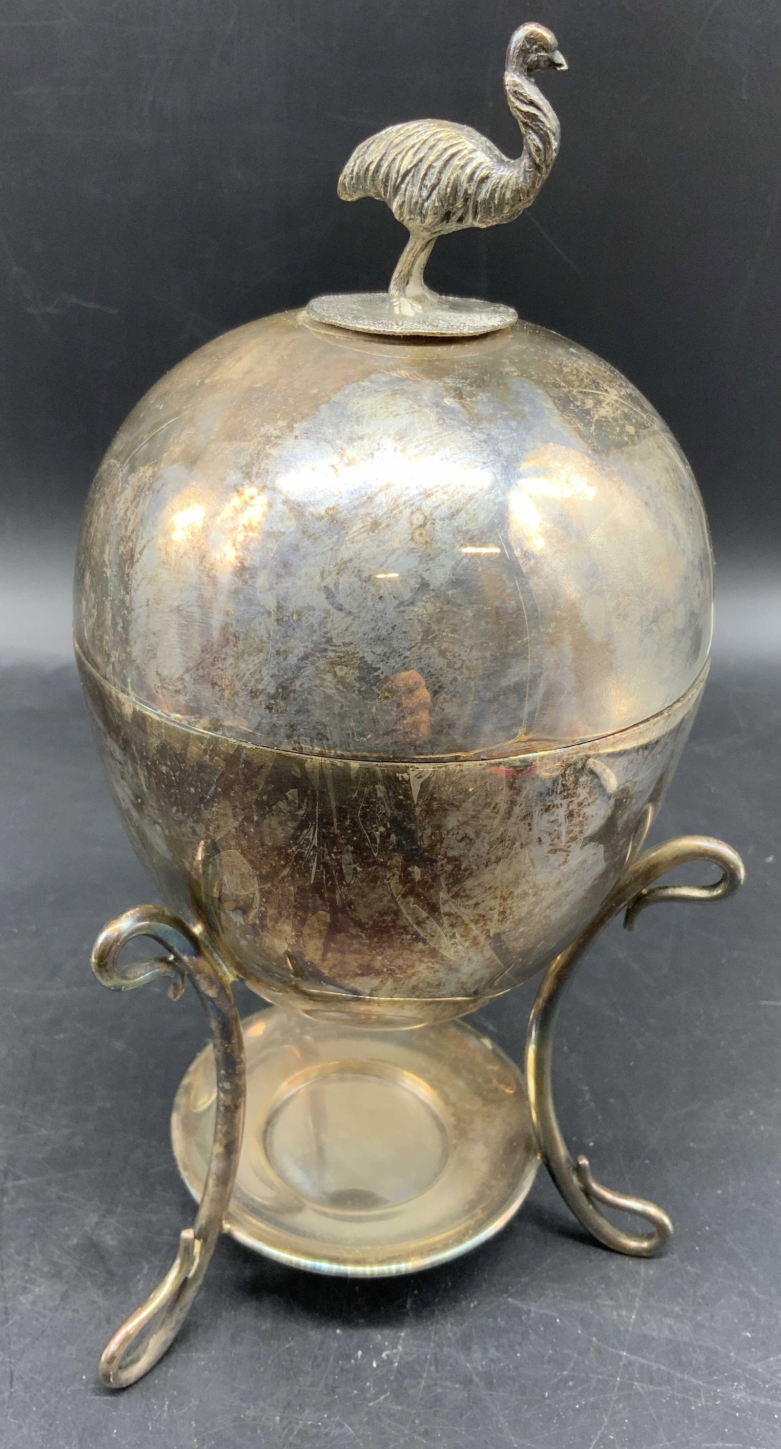 Antique Silver Pl Egg Coddler Ostrich Finial, Eng: Trademarked on underside with a shamrock and 34170, Antique English Victorian silver plated Egg Coddler or breakfast egg boiler, featuring a spherical egg shaped body raised on scroll legs central bur