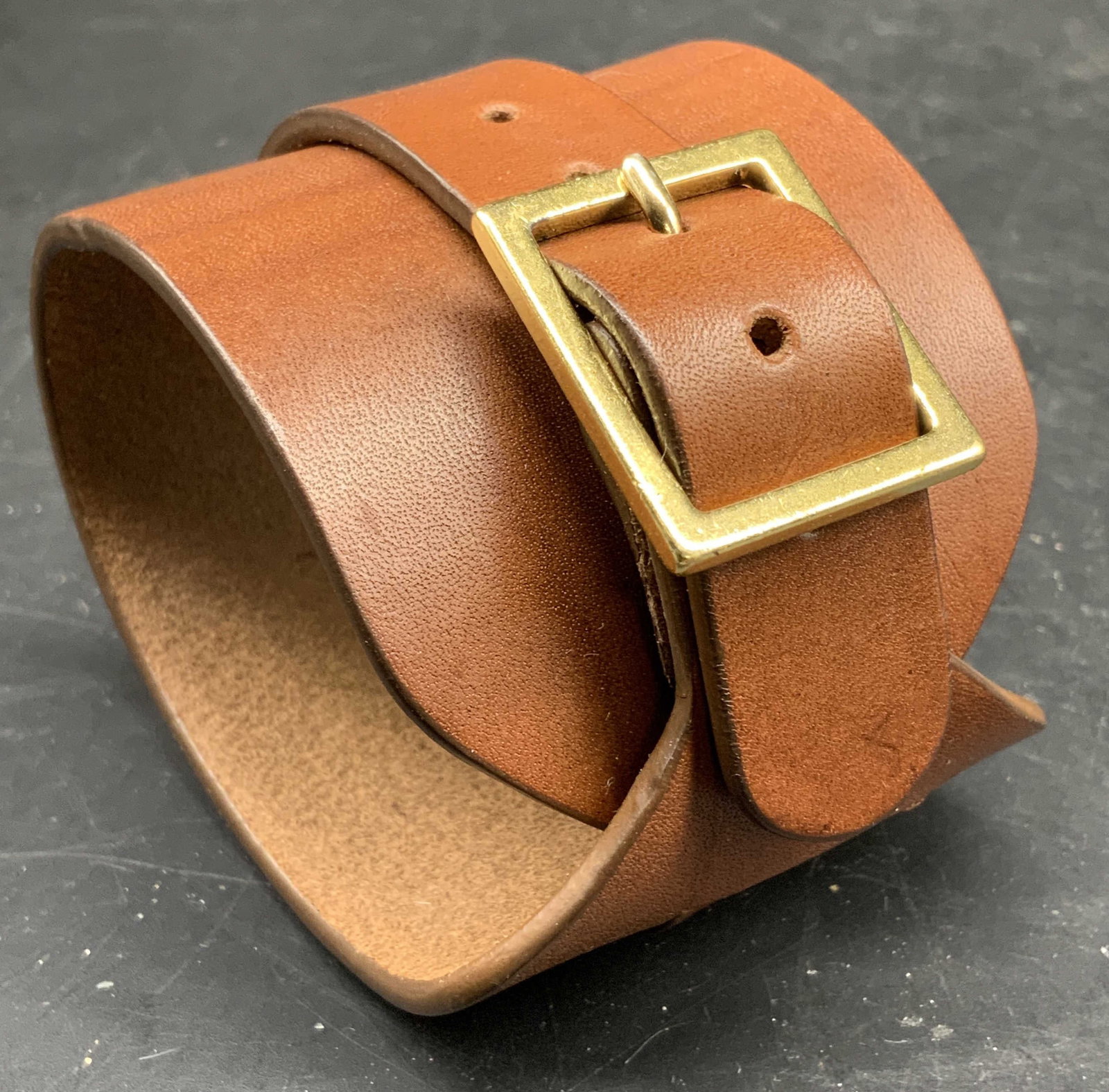 ANNA PORCU Leather Buckle Cuff Bracelet, ITALY: Signed into leather Anna porcu Italia, with etched AP LOGO, Wide tan leather wrap cuff bracelet featuring a polished gold tone square functioning buckle can vary sizes, Statement piece width app 2.25