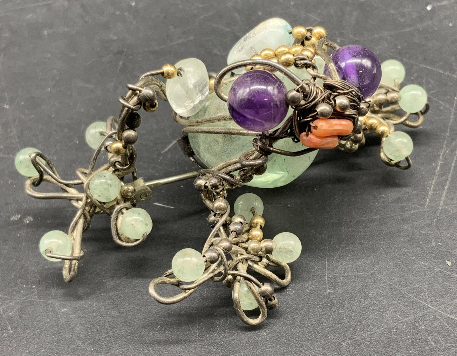 Sgnd sterling wire wrapped gemstone Frog Brooch: Signed with impressed marking on curved sterling plate, letters and symbols obscured due to age and wear, the frog design features intricate organic sterling wire wrapped design, adorned with