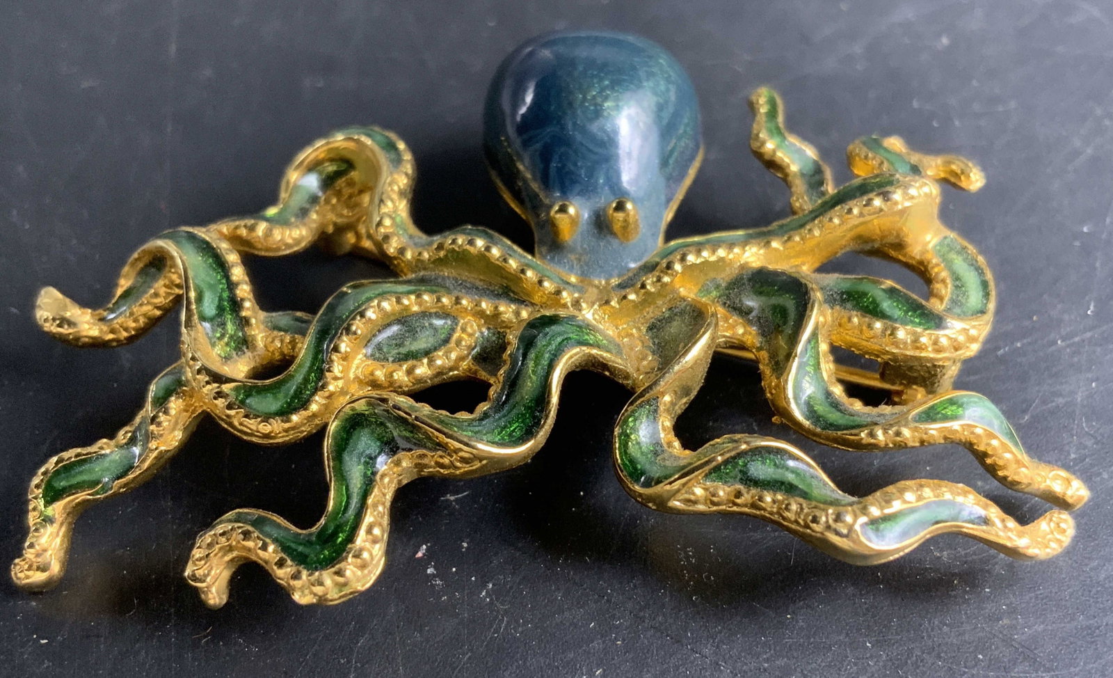 Sgnd MFA Gold Enamel Octopus Brooch: Vintage gold toned octopus brooch signed for MFA, museum of fine arts, eight legs with green enamel and gold bead accents, turquoise indigo and blue toned ovoid head with gold dot eyes, marine theme, 
