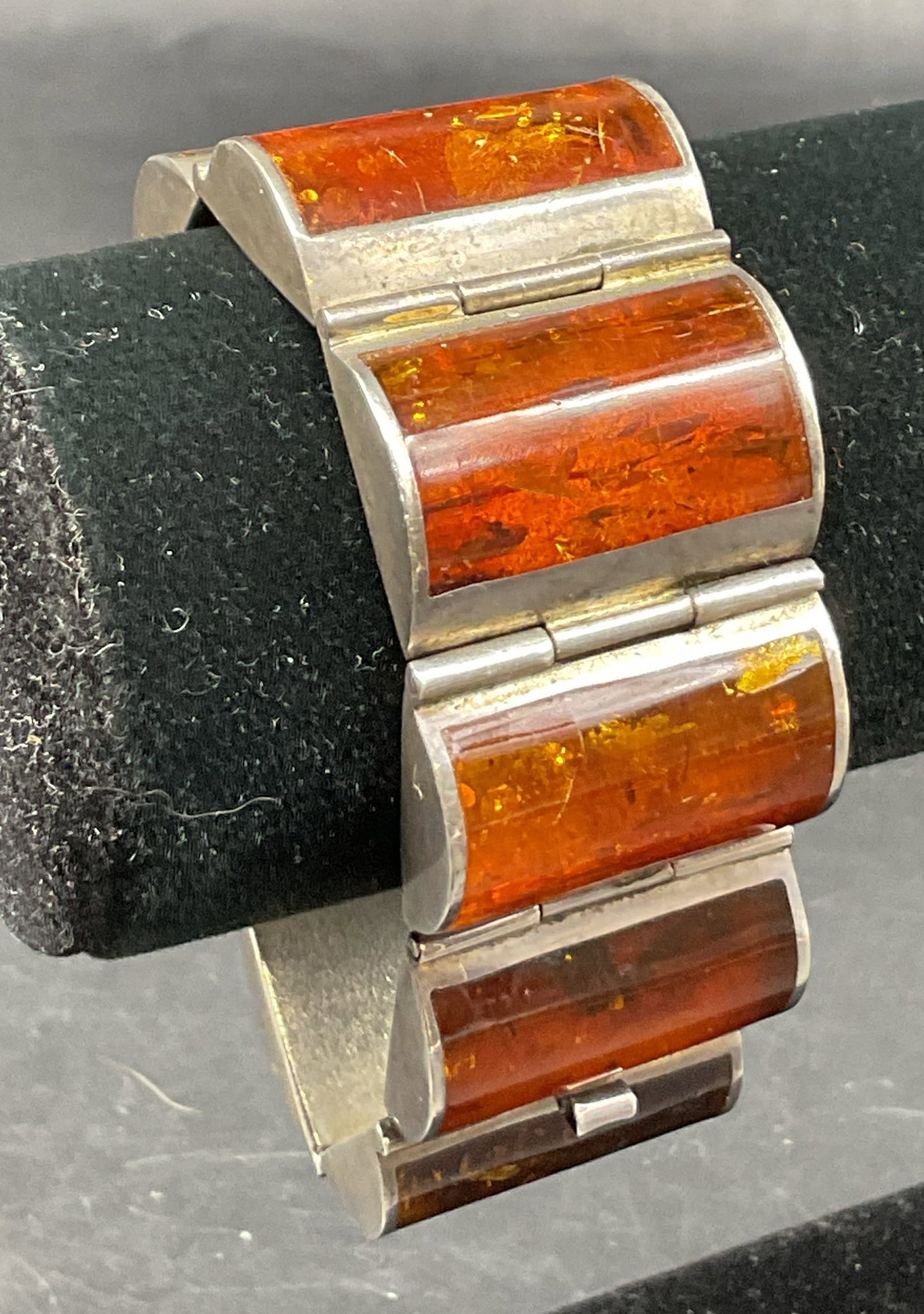 Vtg Sterling Silver Cognac Amber Tennis Bracelet: Vintage sterling silver cognac amber tennis panel link bracelet. Surface marked 925, WKM. Rectangular amber panels linked together. Total weight is 80 grams. Measures approx 7.5 inches full length.