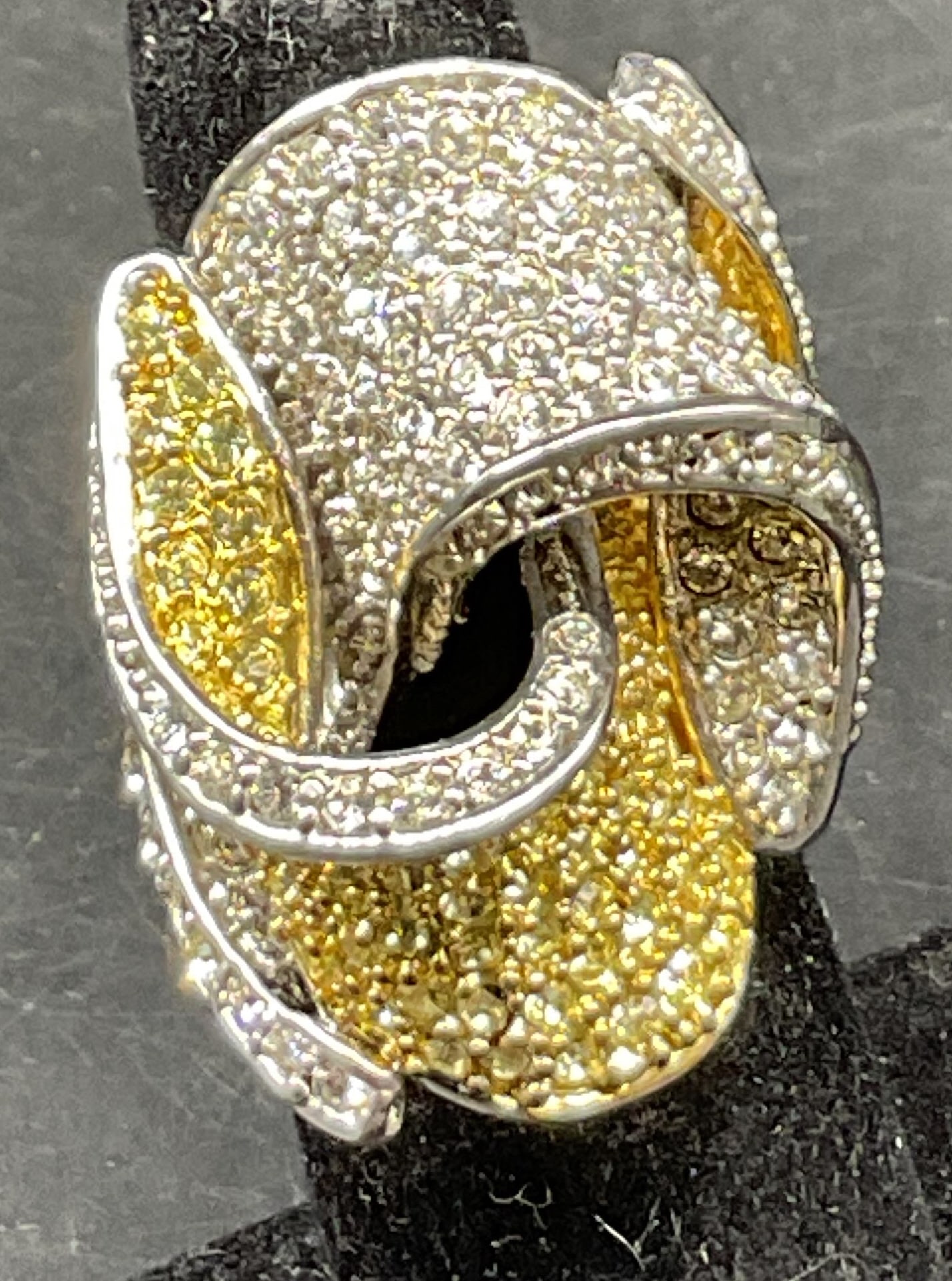 Vintage Two Tone Knot Cocktail Ring: Vintage two tone knot cocktail ring. Silver and gold toned. Clear rhinestones. Intricate design of overlapping loops, forming a knot motif. Measures approx size 6. Scratching. Jewelry, ring, cocktail 