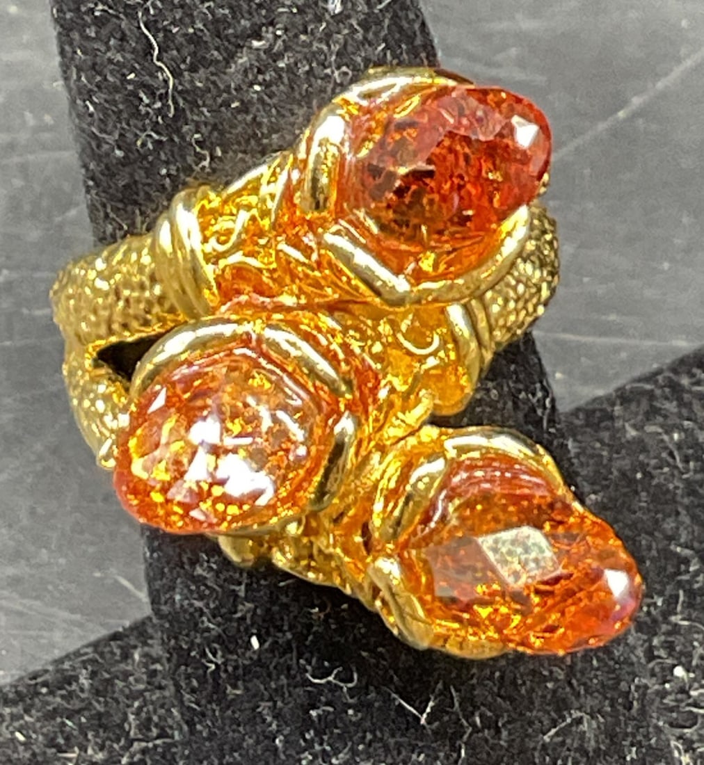Vintage Gold Toned Cluster Ring: Vintage gold toned cluster ring. Three faceted light orange glass beads. Textured band. Clustered design, interlocking. Measures approx size 7. Scratching. Jewelry, ring, estate jewelry, costume