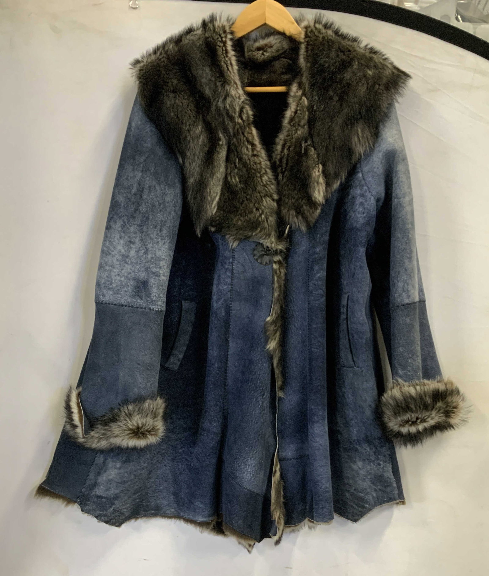 Penny Lane style fur and suede coat: Penny lane style fur and suede coat. Features a distinctive single closure at the chest. Exterior has a worn dusty blue brushed suede finish while the interior is fur lined for insulation. It has a sh