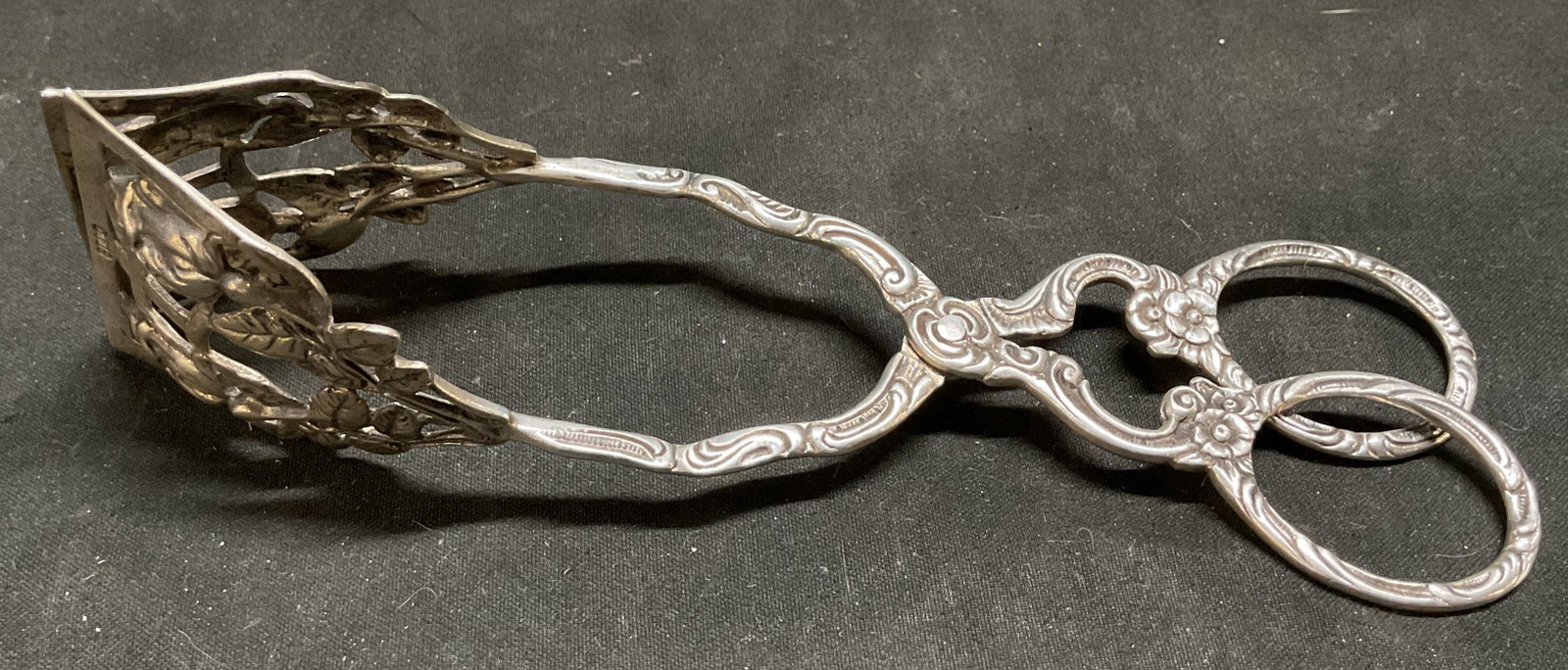 Antique 800 Silver Widman Hildesheim Rose Tongs: Antique Victorian Christoph Widman 800 Silver Hildesheim Rose Pattern Scissor Tongs. Openwork rose design. Marked 800 W. Tarnishing present. Measures app 6in H x 6in L when closed and 3in W when open.