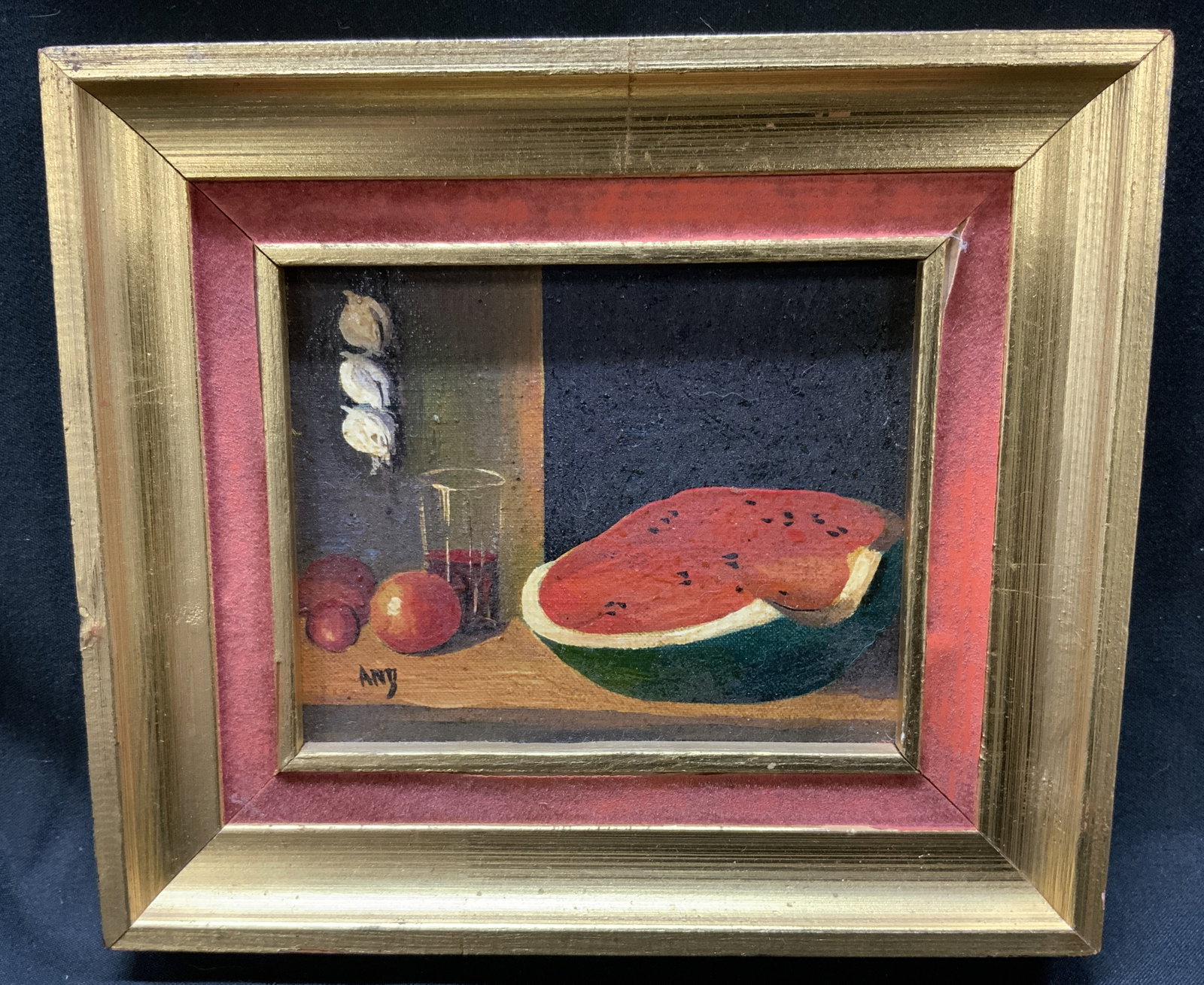 Sgnd Mini Watermelon Still Life Oil Painting Frmd: Signed mini watermelon still life oil painting on board. Signature reads illegibly. Watermelon on table with cup of juice and other fruits, garlic hanging on wall. Frame, surface wear to frame, profes