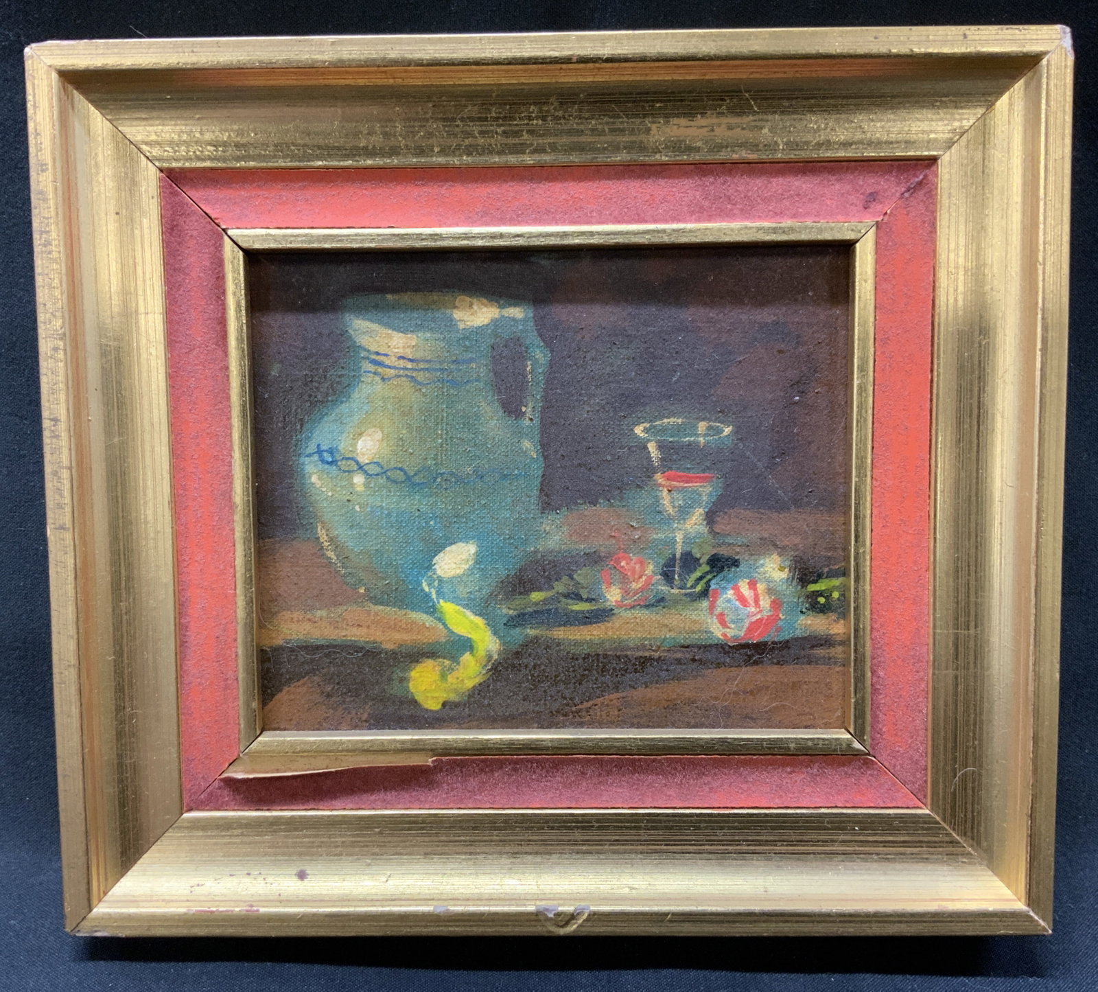 Mini Still Life Oil Painting Frmd: Signed mini still life oil painting on board. Water jug, glass and possibly candies on brown tabletop. Frame, surface wear to frame, professionally framed, not examined out of frame. Framed in