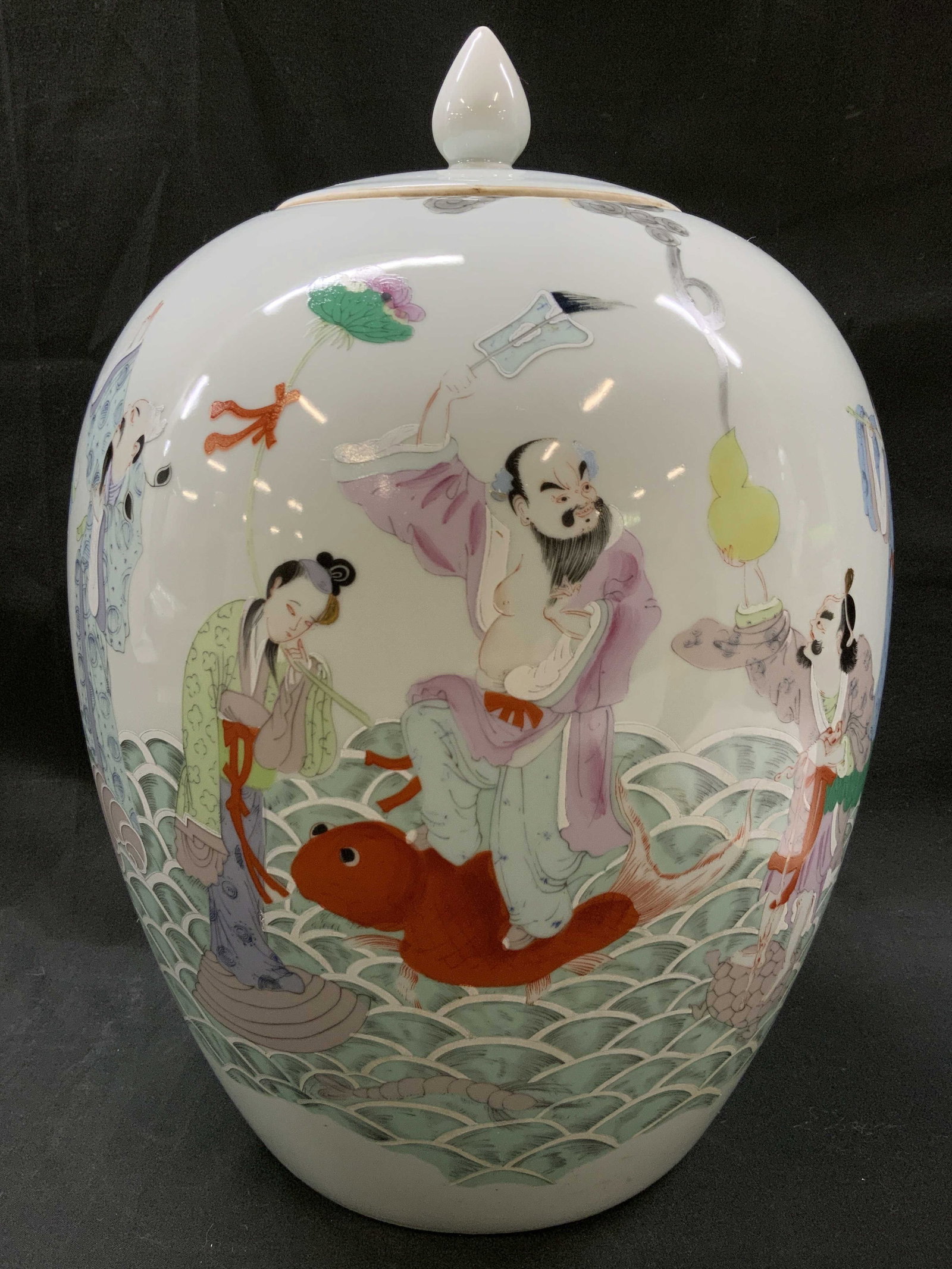 Vtg 8 Immortals Famille Rose Porcelain Ginger Jar: Vintage ploy chrome painted porcelain depiction of Eight Immortals crossing the sea. Lid decorated with a figure in a cloud of smoke and flower accents. Condition consistent with age and exposure. Mea