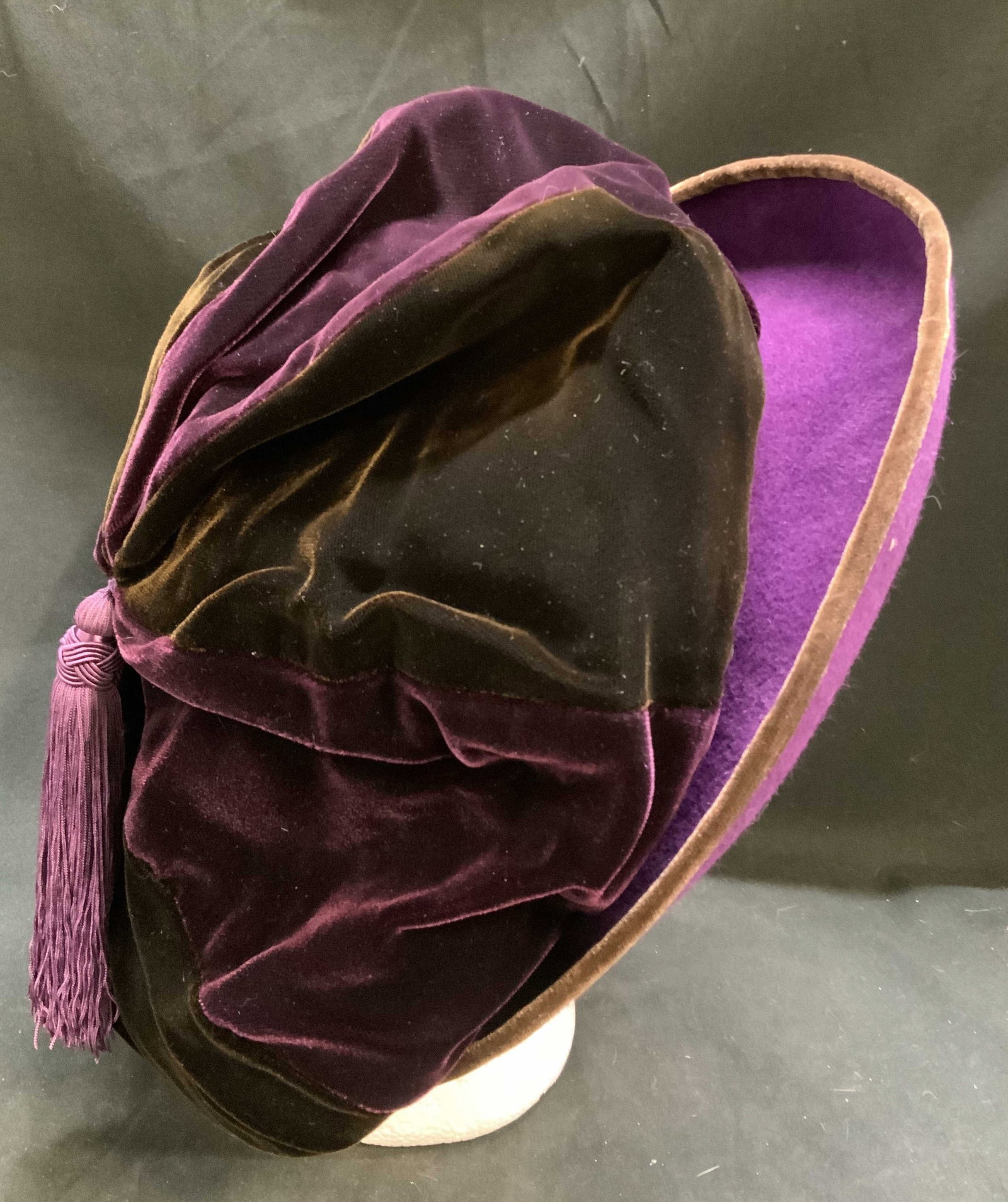 Vtg Sarah Gavaghan Purple Velvet & Felt Slouch Hat: Vintage Hats by Sarah Gavaghan Luxury Purple and Brown Velvet and Felt Slouch Hat. Purple tassel accent. New York and London. Condition consistent with age and exposure. Measures app 6in Head Diam x 1