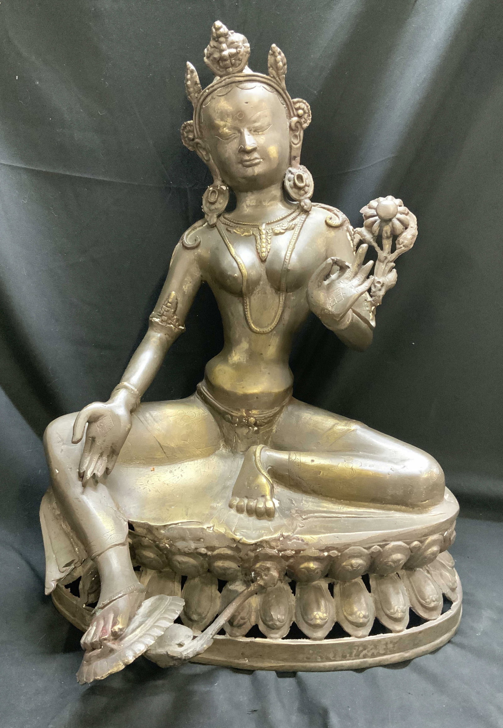 Sino-Tibetan Gilt-Bronze Buddhist Deity Fig: Sino-Tibetan Heavy Gilt-Bronze Buddhist Deity Figurine. Possibly depicts Green Tara. Has significant weight. Royal ease posture with left leg folded inward in meditation and right leg extended downwar