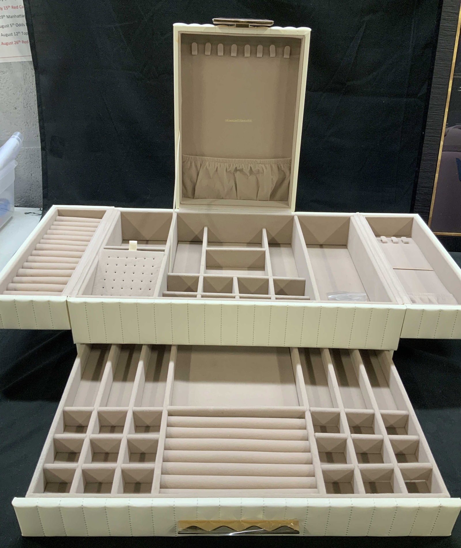 SONGMICSHOME multi compartment jewelry box: SONGMICSHOME multi compartment jewelry box. Wrapped in a textured cream/beige faux leather with a soft velvet lined interior. Features side extension tiers, customizable grids, an earring stud section