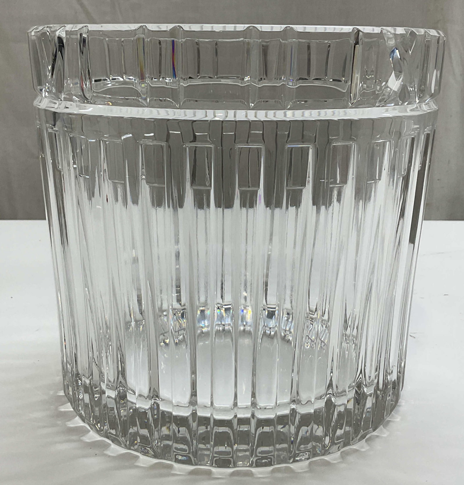 SGND Tiffany & Co Crystal Atlas Ice Bucket: Signed Tiffany & Co crystal Atlas ice bucket. Signed Tiffany & Co on underside. Tall round barrel shaped body. Distinct Roman numeral motif around rim. Vertical fluted panels. Ribbed and textured surf