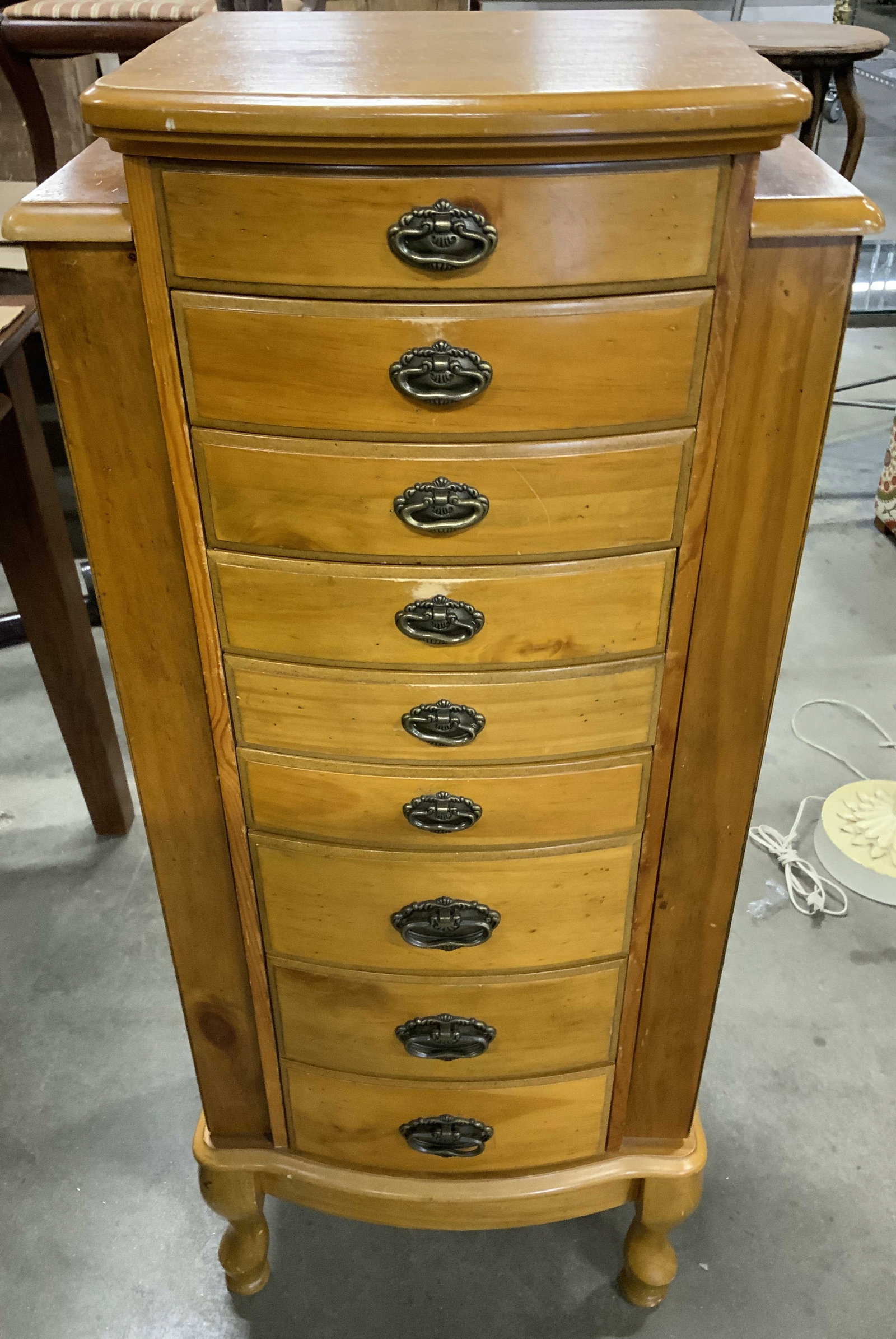 Free Standing 8 Drawer Pine Jewelry Armoire: Free standing jewelry armoire in pine wood with flip top mirror, short cabriole feet, two side cabinets that open for necklaces and eight drawers with black felt se Timons and compartments, closed