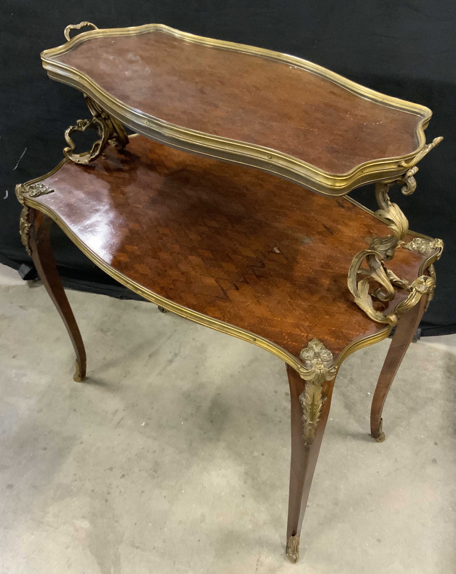 Antq French Louis XV Style Tea Table: Antique French Louis Tea Table dessert table with wood veneer and gilt bronze mounts, circa Late 19 early 20th century, features two rectangular tiers with shaped edges and raised rims, top piece has