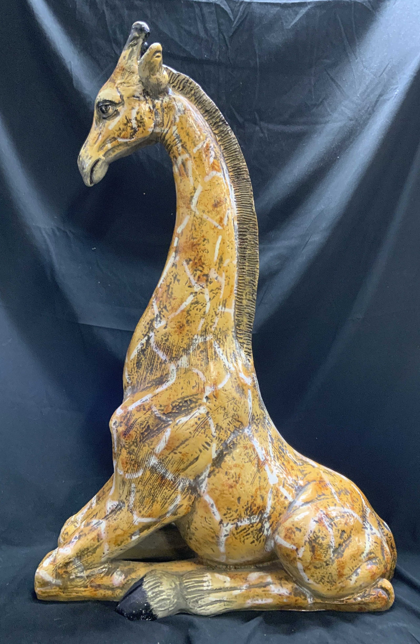 Vintage Glazed Seated 2Foot Giraffe Sculpture: Vintage Glazed Seated Giraffe Sculpture. Yellow, and brown glaze with white spot details. Composite material. Possibly Chalkware. Has significant weight. Chips to glaze. Measures app 33.5in H x 22in