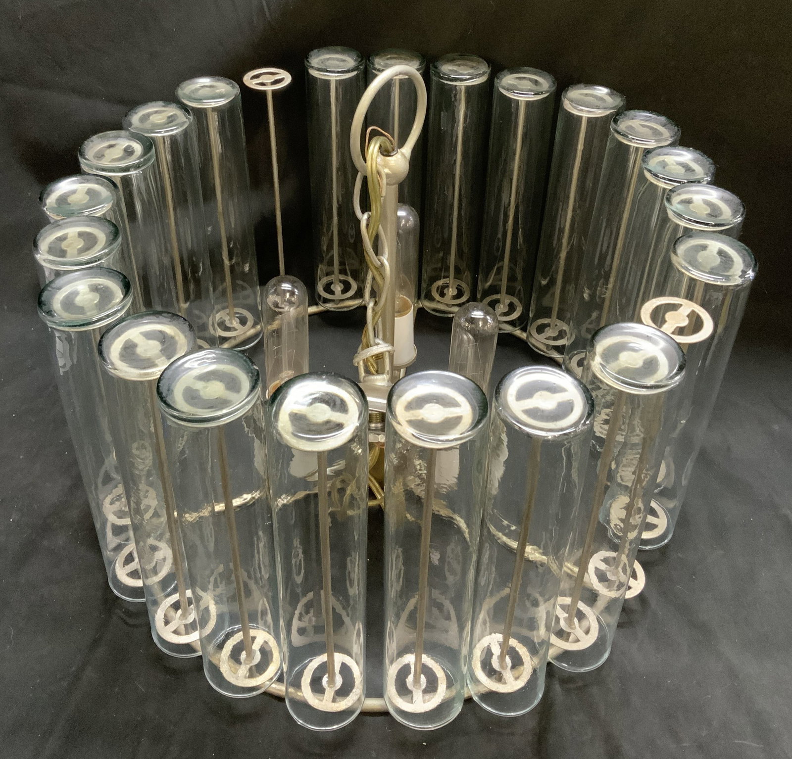 Mid-Century Modern Glass Tube Chandelier: Vintage Mid-Century Modern Circa 1960s Space Age Glass Tube Chandelier. Features an arrangement of open-ended clear glass cylinders hooked individually along a circular tiered enamel-coated steel fram