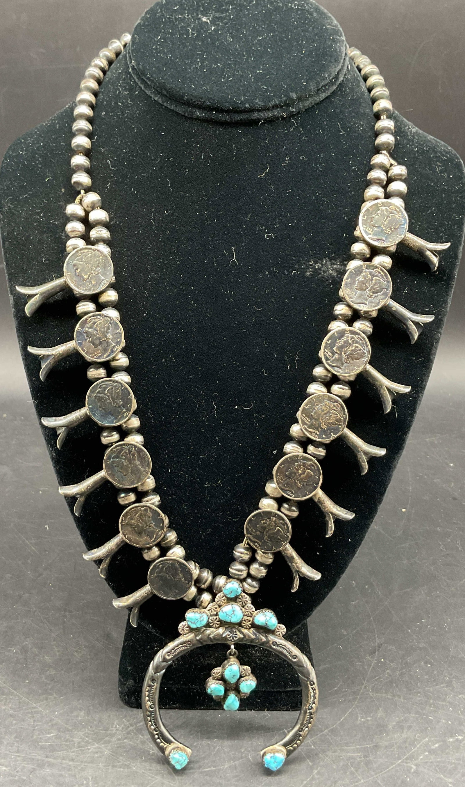 Mike Platero Sterling Silver Navajo Necklace+: Mike Platero sterling silver American Navajo style squash blossom turquoise necklace. Tested as sterling with PuriTEST. Surface marked Mike Platero. At the bottom is a large horseshoe shaped Naja pend