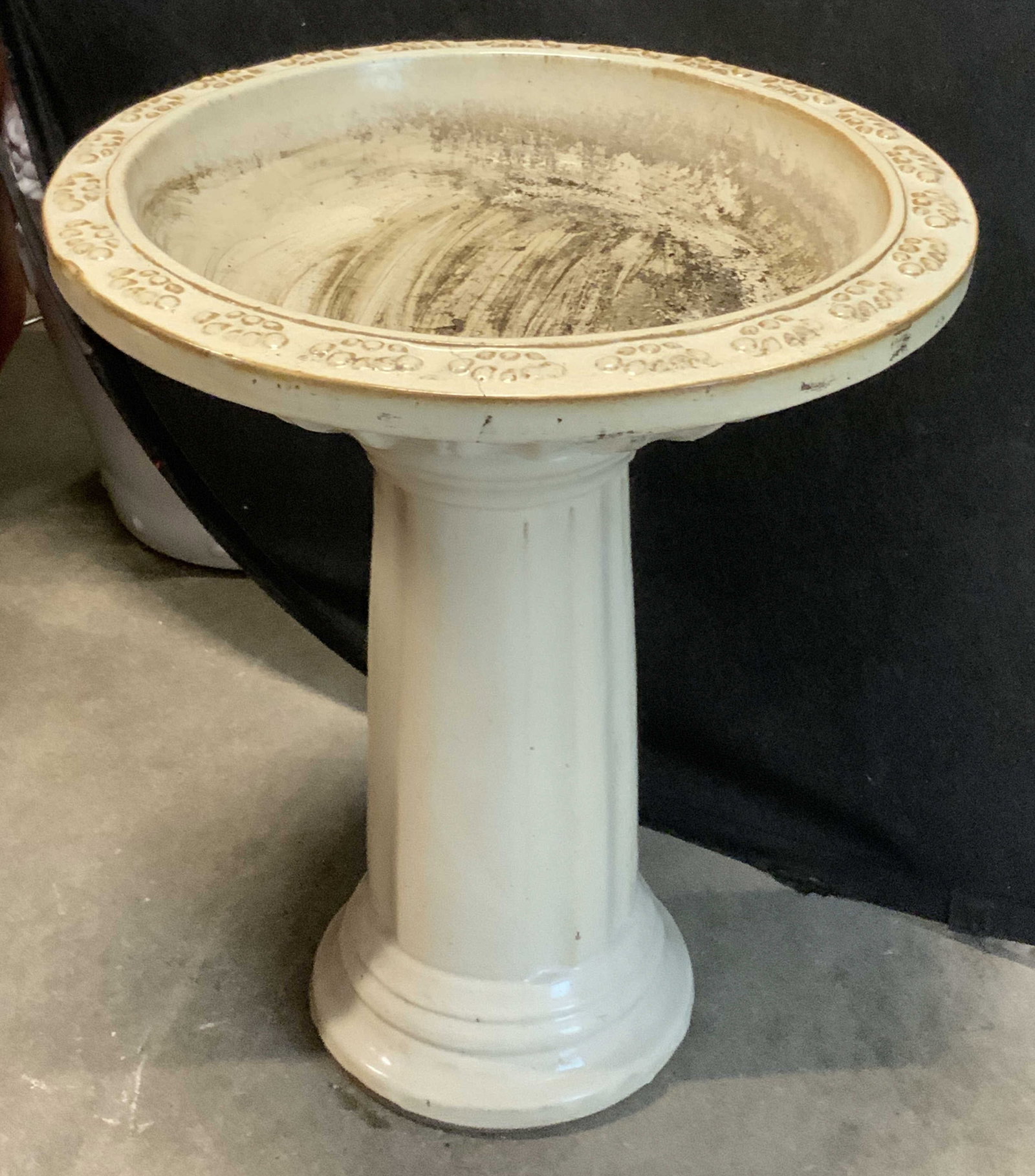 Vintage Ceramic Birdbath Pedestal: Vintage Ceramic Birdbath Pedestal. Cream-Colored with geometric pattern around rim. Scuffing and cracks present. Measures app 23in H x 20in Diam. vintage birdbath, ceramic, pedestal, garden decor,