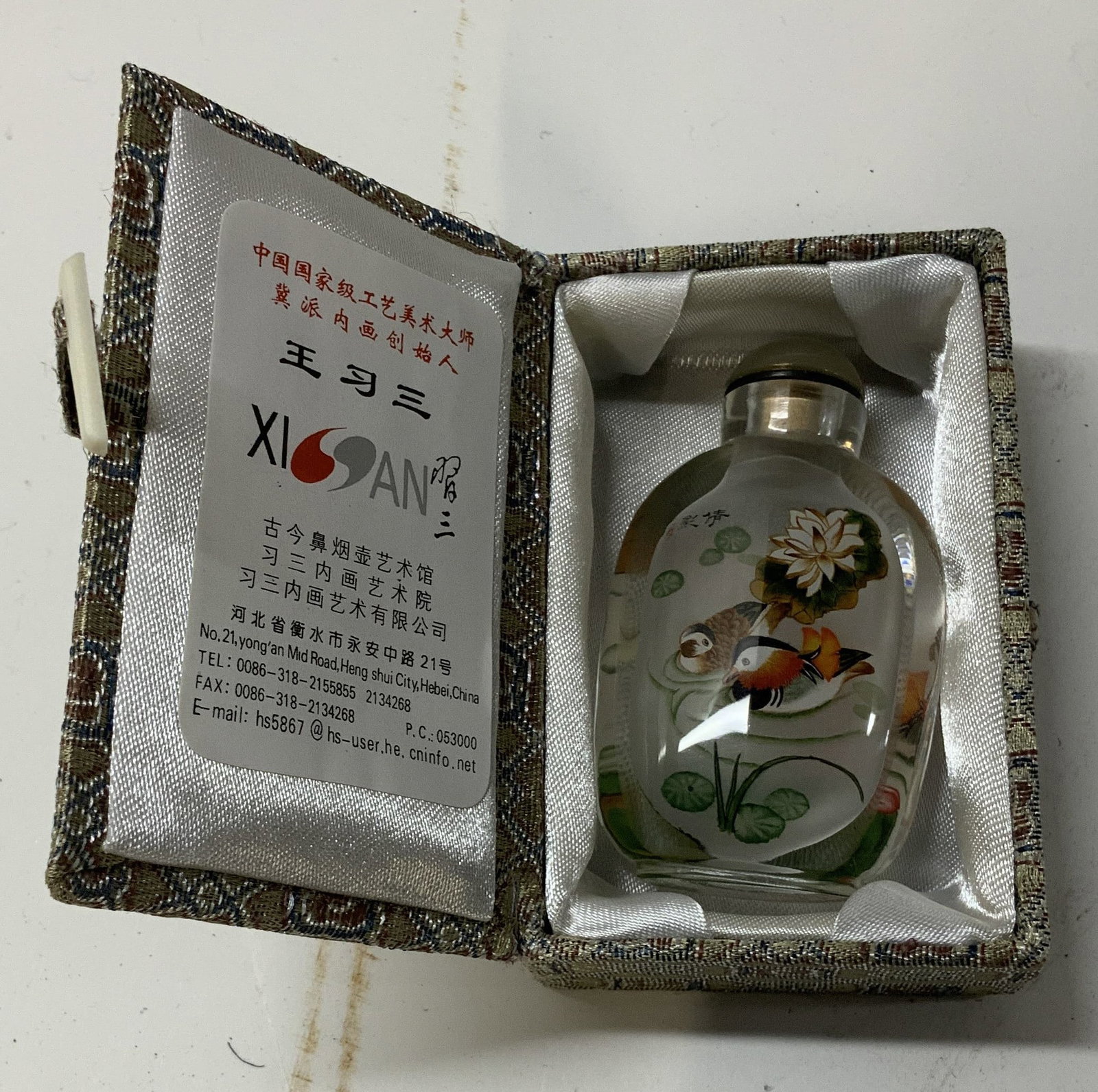 Vntg Iside painted glass snuff bottle& box , China: Vintage Chinese inside painted glass snuff bottle with box. Bottle features a duck and lily ,presented in a padded silk geometric print box with labels referencing master artist Wang Xisan. Box also i