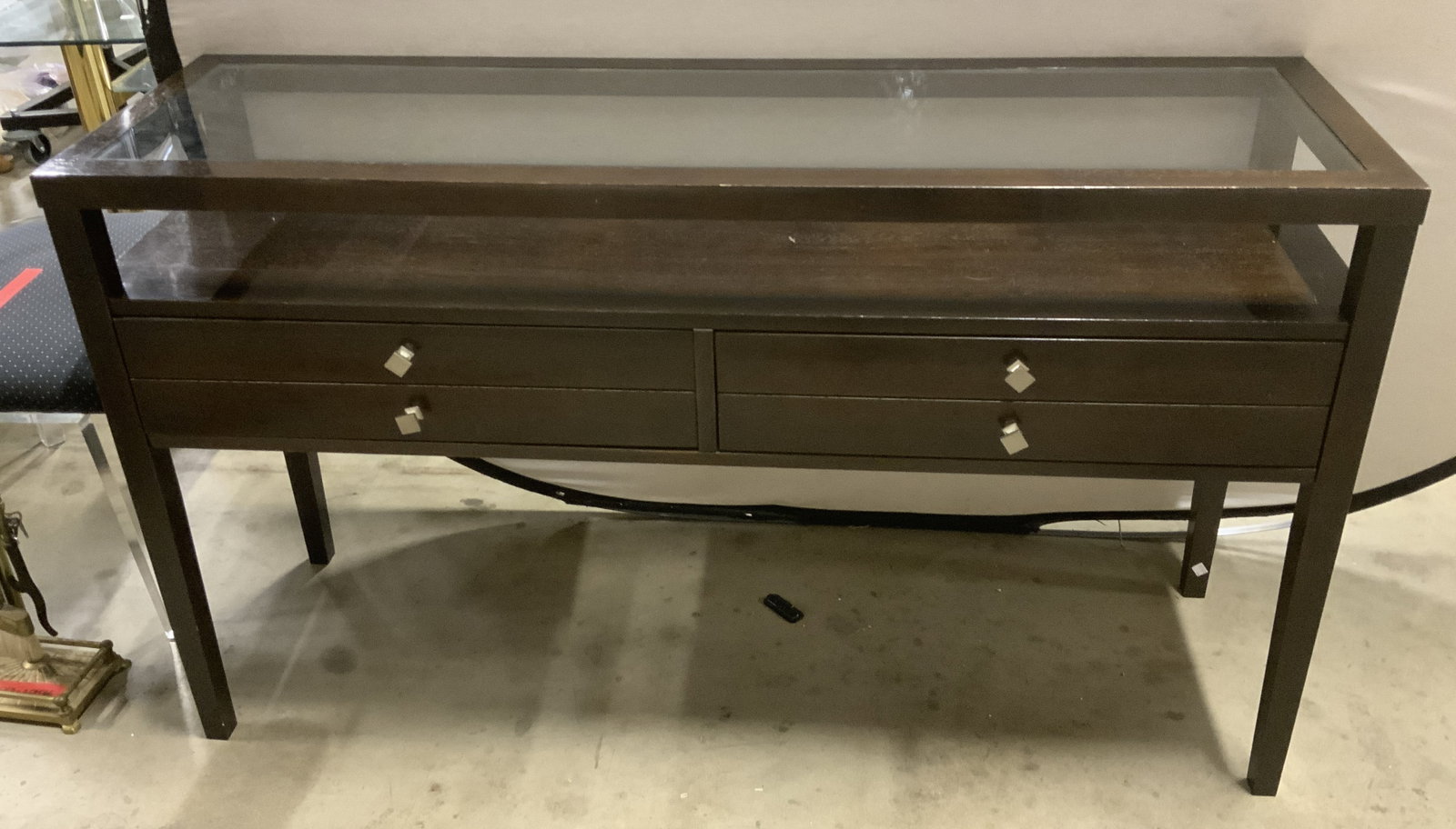 Dark Espresso Wood Writing Desk: Dark Espresso Wood Writing Desk. Integrated clear glass insert top. 2 drawers. Brushed silver-toned pull knobs. Scratching on glass and wood present. Measures app 32in H x 54in L x 16in W. dark