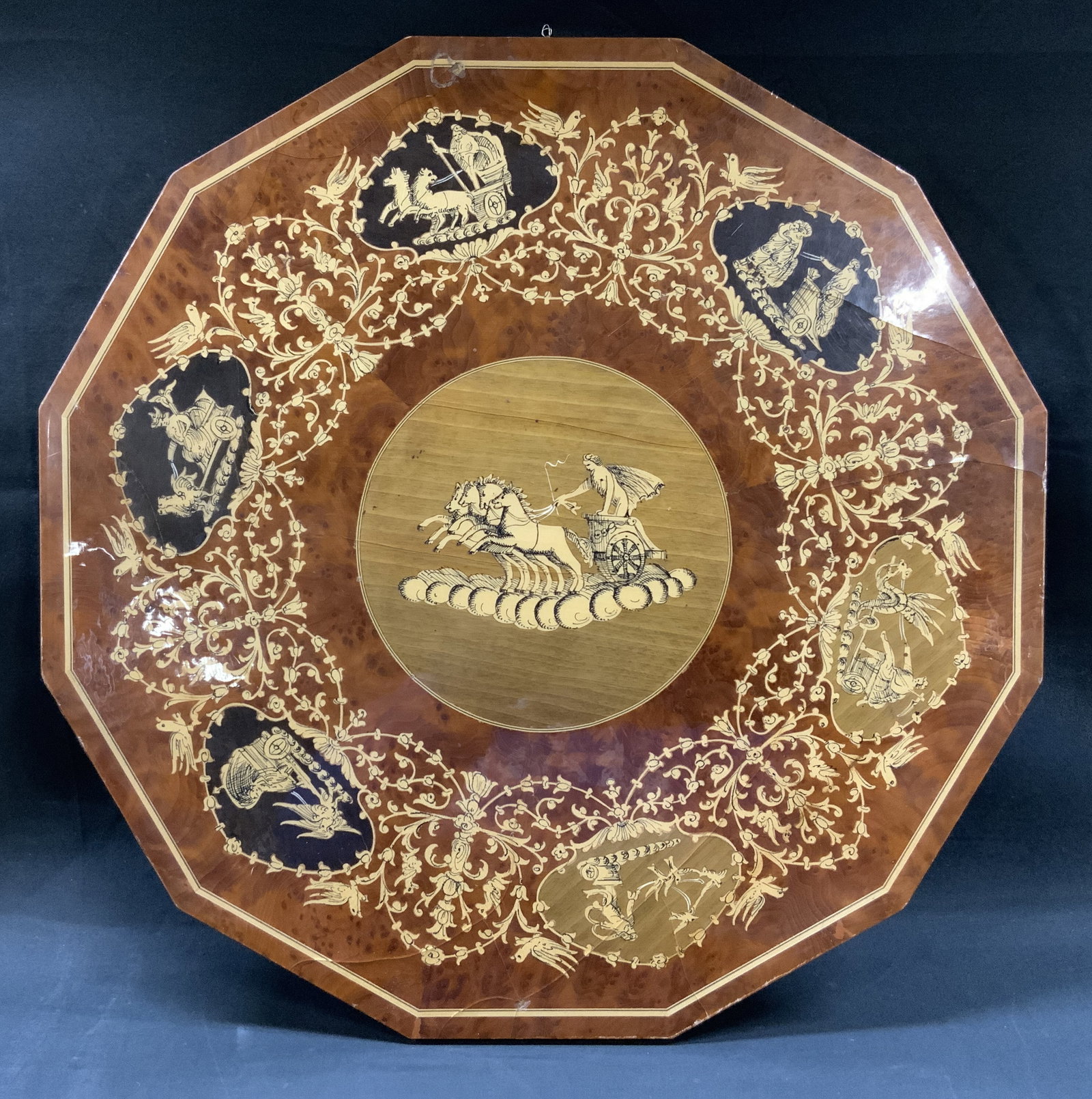 Vtg Italian Sorrento Marquetry Wall Plaque: Vintage Marquetry wall plaque, made in Sorrento, Italy. Octagonal panel features wood inlay hand crafted from walnut and maple. Central medallion illustrates classical Roman warrior driving horse char