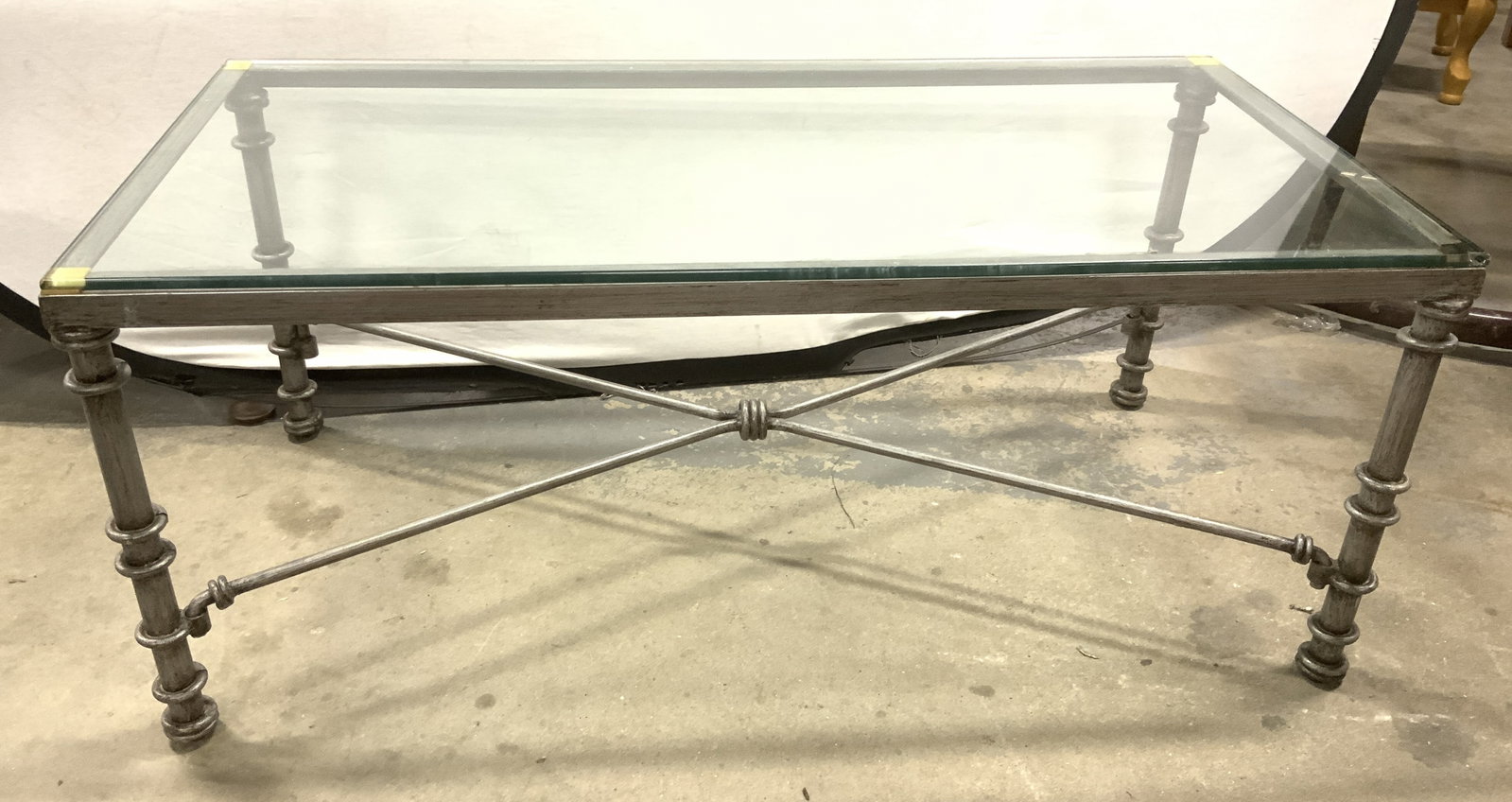 Vtg Polished Metal & Glass Console Table: Vintage Polished Metal and Glass Console Table. In the style of Diego Giacometti, featuring a textured black and grey pewter-finish metal base with distinctive X-form stretcher. Twist design around
