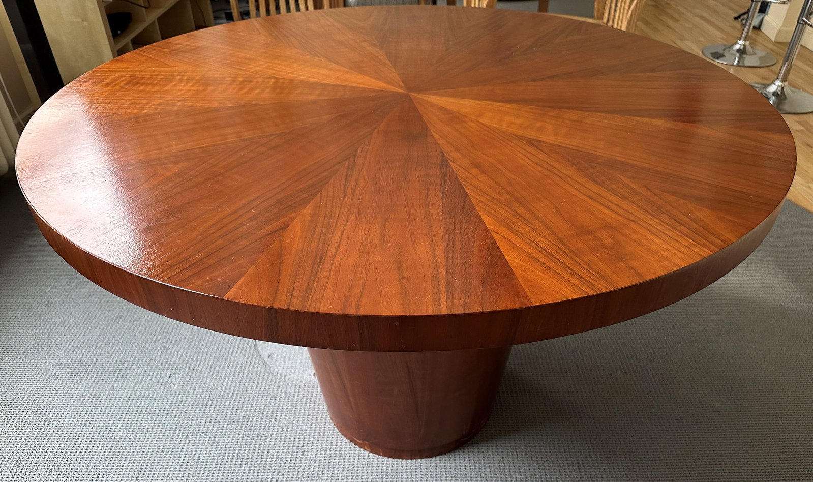 Crate and Barrel Nova Dining Table: Crate and barrel Nova Dining table , a discontinued piece featuring a 60 inch round table top finished with a distinctive starburst veneer pattern. It is supported by a heavy cylindrical drum base