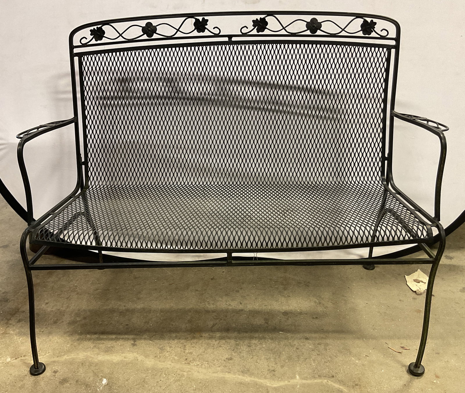 Vtg Woodard Black Wrought Iron Garden Bench: Vintage Woodard black wrought iron garden bench. Attributed to Salterini, possibly from the Briarwood collection. Seat and backrest have an open mesh design. Backrest features a decorative scrollwork 