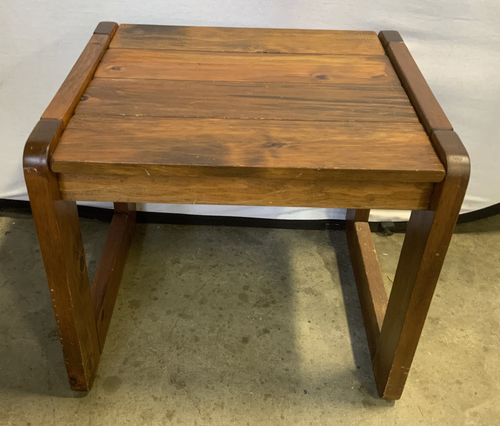 Vtg Mid-Century Brutalist Pine Side Table: Vintage Mid-Century Circa 1970s Brutalist Pine Wood Side Table. Thick unadorned planks. Chunky rectangular block legs. Exposed metal peg detailing. Scratching present. Measures app 20in H x 22.5in L x