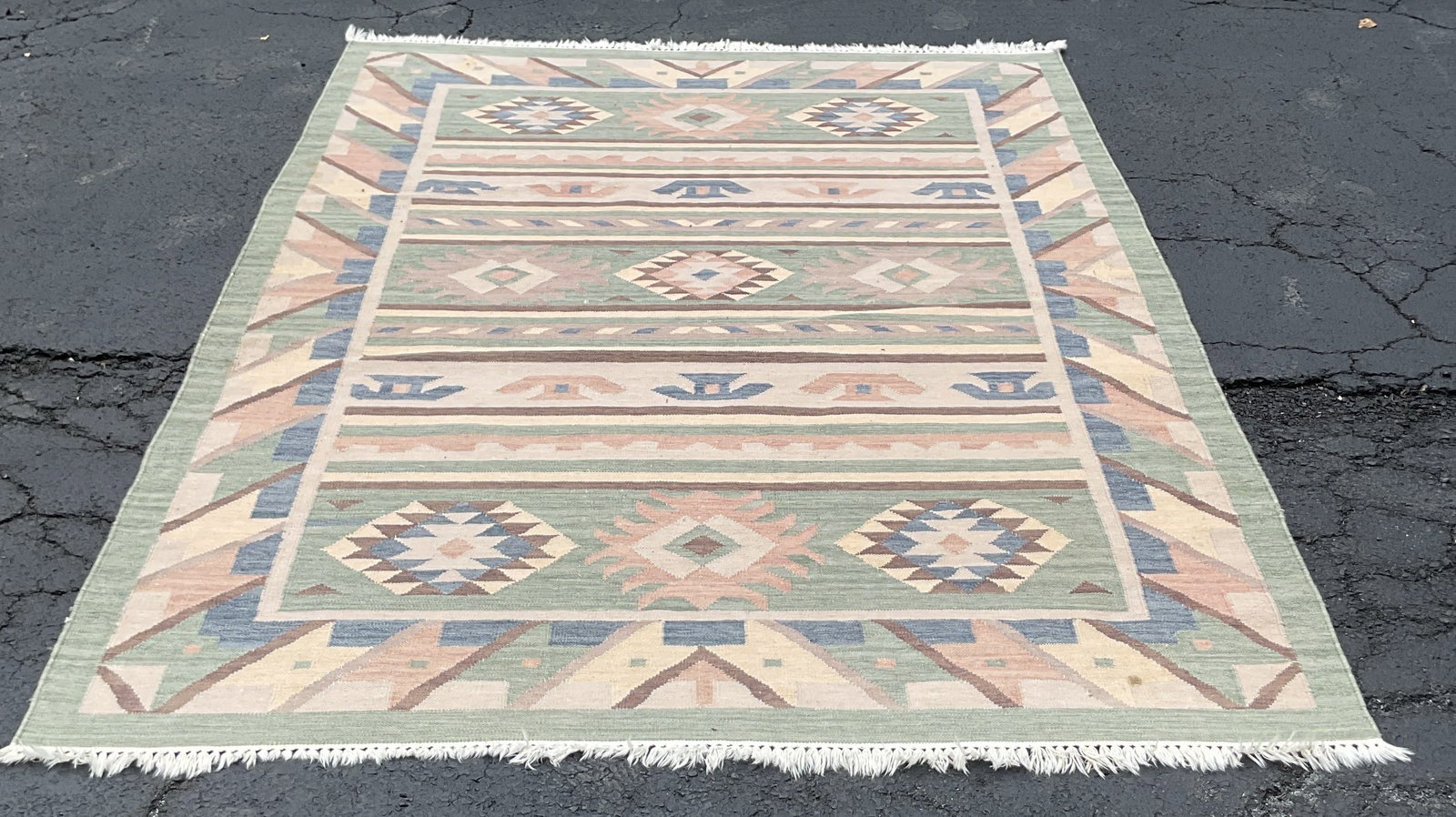 Vintage Flatweave Turkish Kilim Rug: Vintage Flatweave Turkish Kilim rug. White fringed trim. Geometric stripes and medallions in green pink blue cream tones. Measures approx 70 x 90 inches. Blemishes. Rug, carpets, home decor, decor, ho
