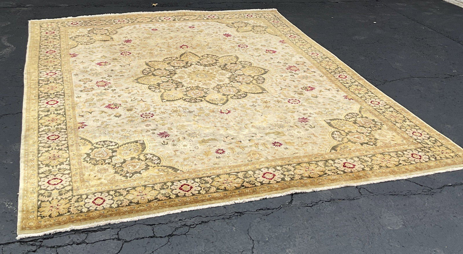 Traditional Hand Knotted Wool Area Rug: Traditional hand knotted wool area rug. White fringed trim. Central floral medallion with repeating motif surrounding. Beige, white, green, red, etc. Ornate leaf motifs. Measures approx 96 x 118