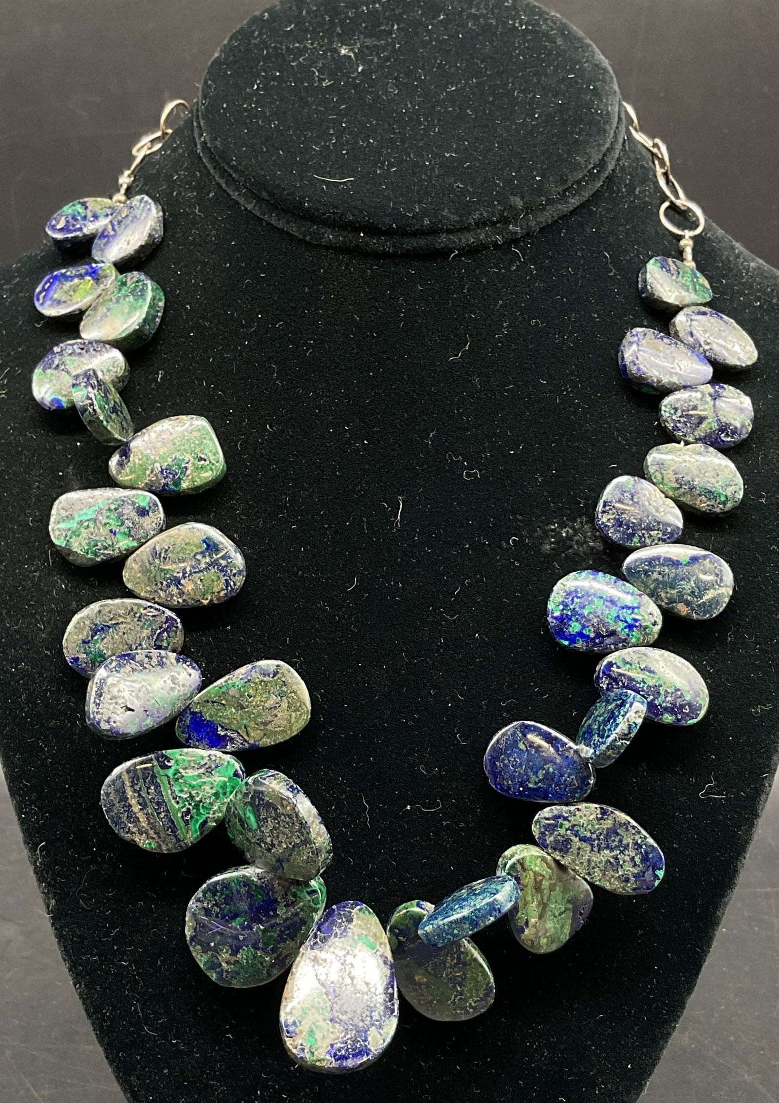 Vtg Sterling Silver Semiprecious Necklace: Vintage sterling silver semiprecious gemstone statement necklace. Clasp is marked 925. Polished teardrop shaped semiprecious gemstones in green and blue. Tested with Presidium Gem Tester II. Cluster d