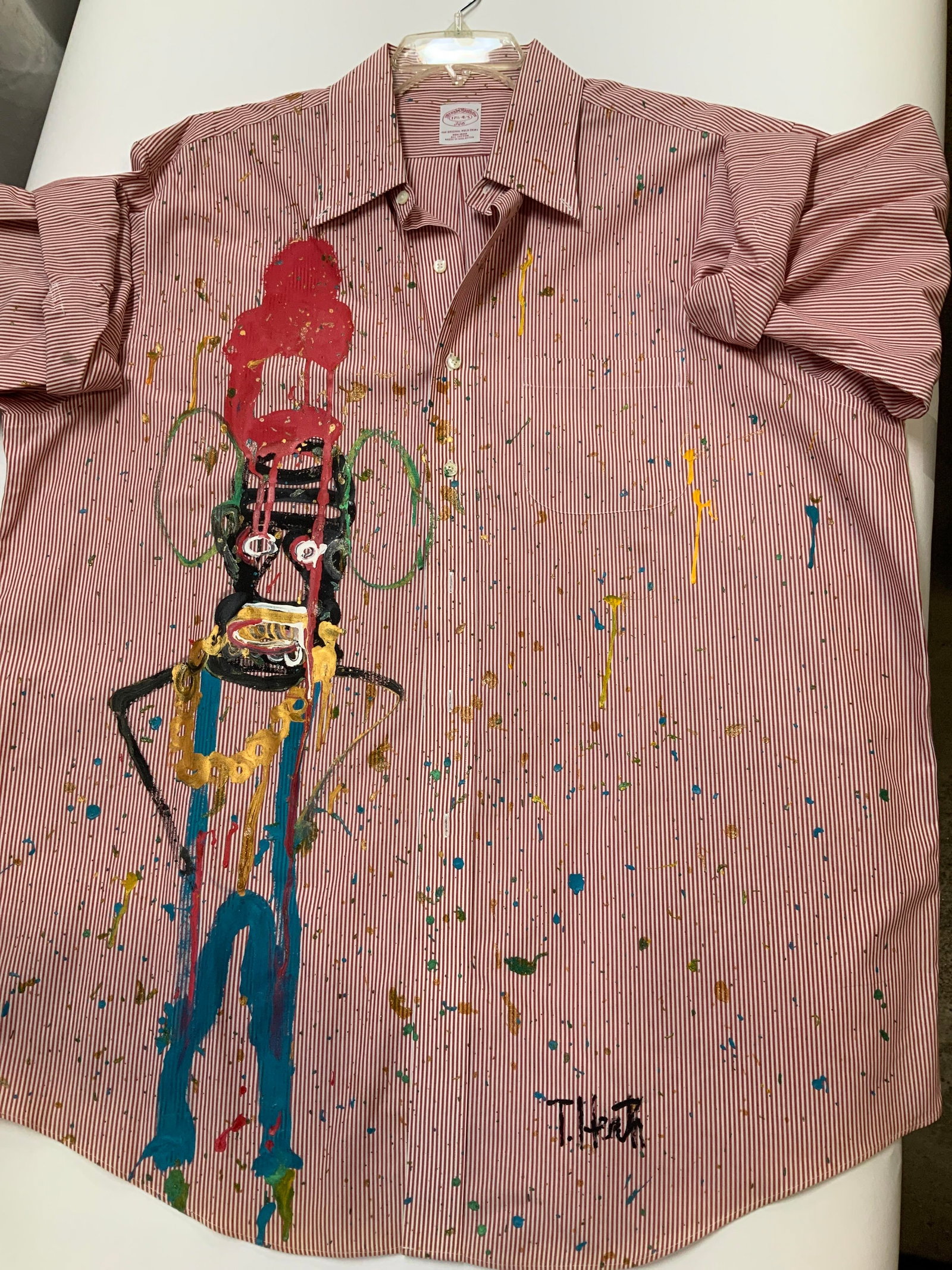 Brooks Brothers one of a kind hand painted shirt: Brooks Brothers one of a kind hand painted shirt. Size 17 1/2-4/5. Painted by Thomas Heath of his clothing line and character Aboo. Thickly applied hand painted artwork takes up the entire right side