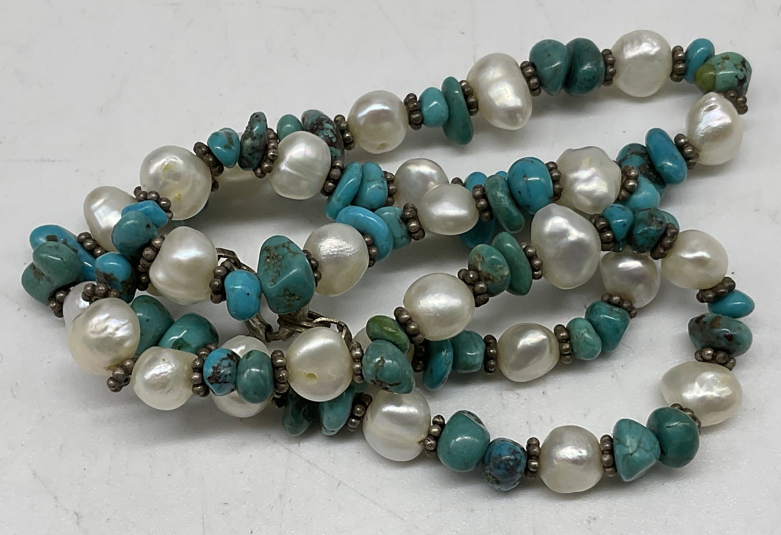 Natural Freshwater Pearls&Stab Turquoise Necklace: Natural Freshwater Pearls and Stabilized Turquoise Chip Necklace. Sterling Silver clasp and spacer beads. Marked 925. Tarnishing present. Measures approx 15.5in L. Total weight 20g. freshwater