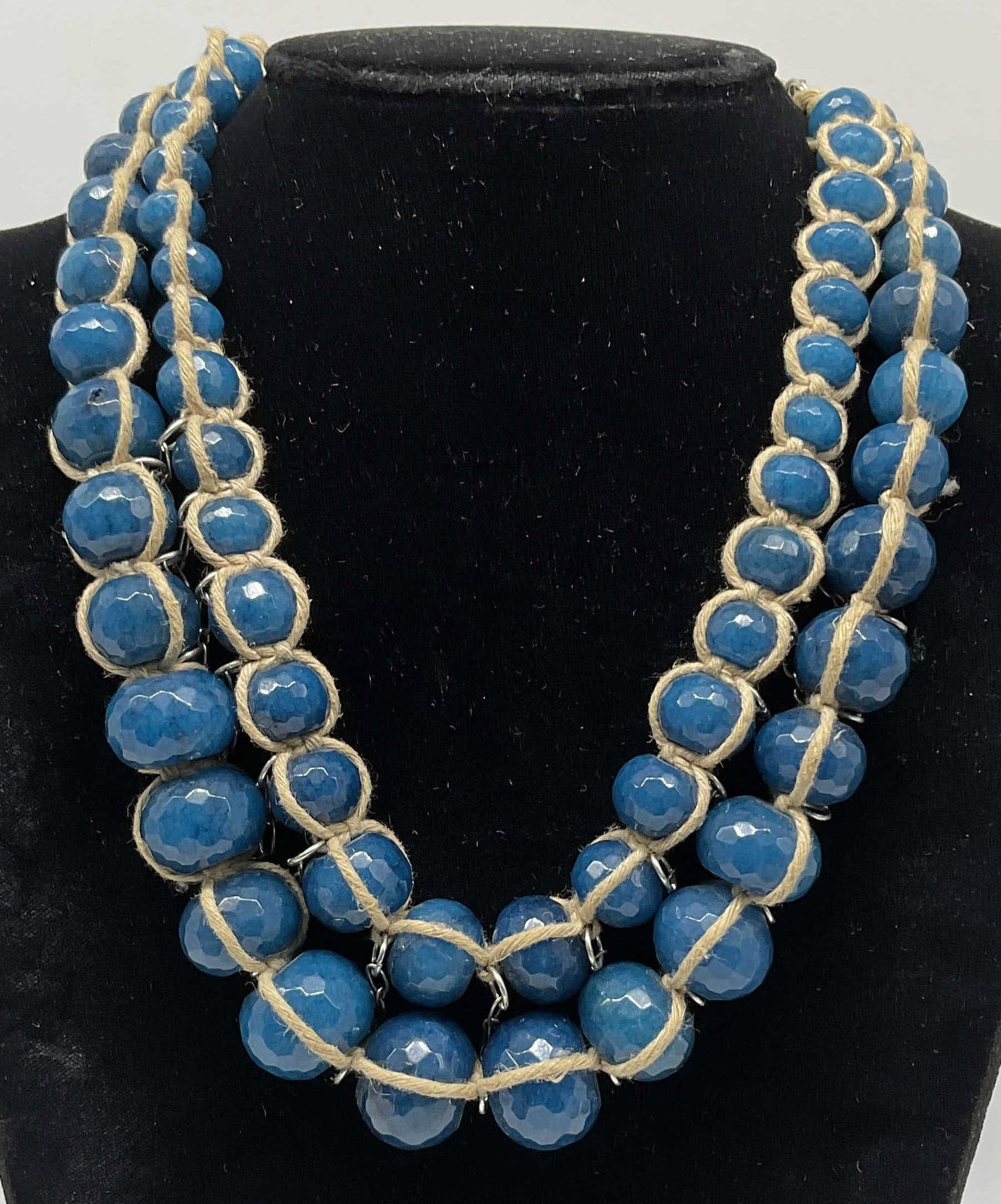 VTG Coldwater Creek Blue Dyed Quartz Necklace: Vintage Coldwater Creek Blue Dyed Quartz Multi-Strand Statement Necklace. Tested with Presidium Gem Tester II. Three different size circular beads. Wrapped in tan rope. Some aging to metal. Adjustable