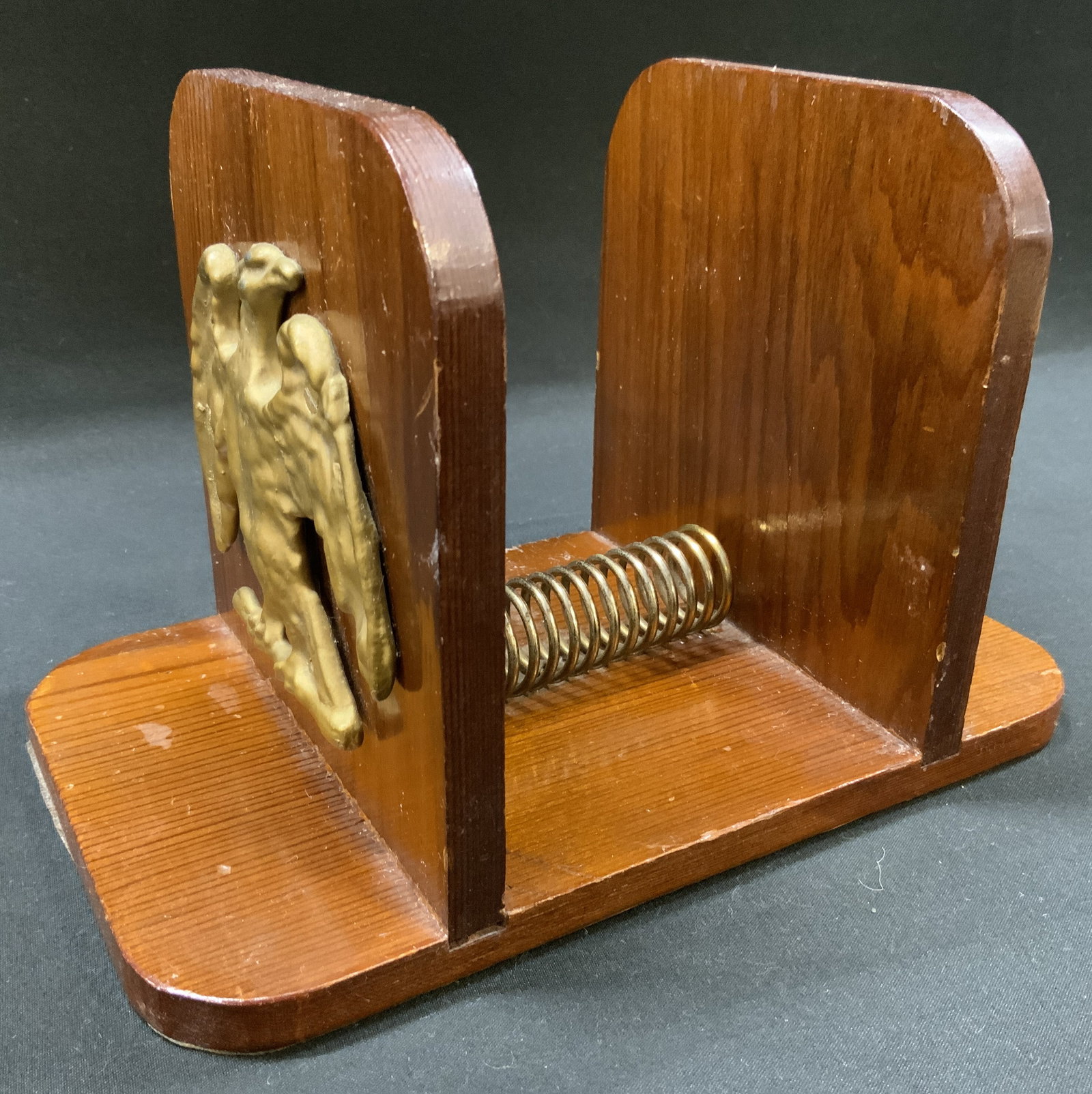 Vtg Wood Eagle Spring Mail Napkin Holder: Vintage dual purpose desktop letter organizer or dining table napkin holder. Stained wood construction with raised gold finished American Eagle emblem on both sides exterior. Heavy gauge coil spring