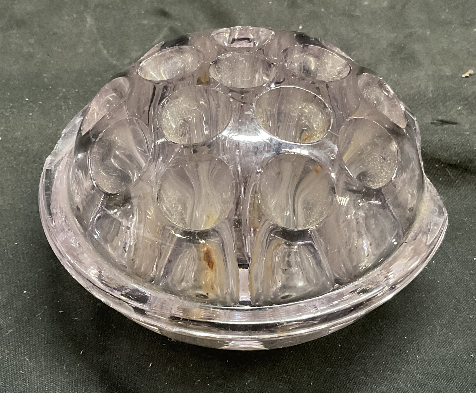 ANTIQUE Domed Purple Glass Flower Frog: Antique Domed Light Purple Glass Flower Frog. Patent date on side reads April 1916. Used as floral arrangement stem Holder at bottom of vase. Chips present. Measures approx 4.25in Diam. vintage glassw