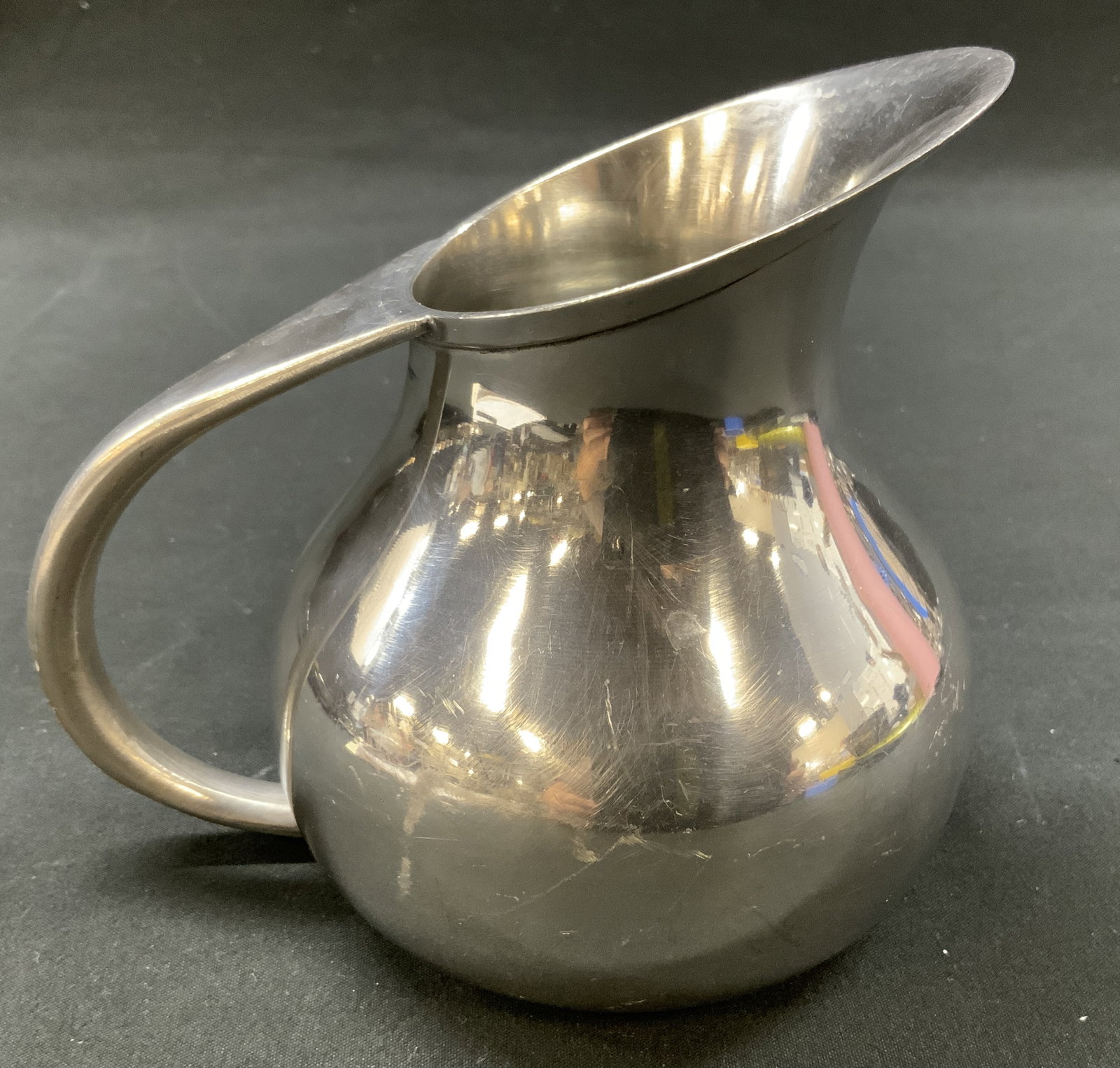 Vtg Burges Bladon Middleton Pewter Pitcher, UK: Vintage leadless pewter creamer pitcher manufactured by Burges Bladon & Middleton in Birmingham, England. Smooth bellied body silhouette with swooping top handle and wide pouring spout. Underside
