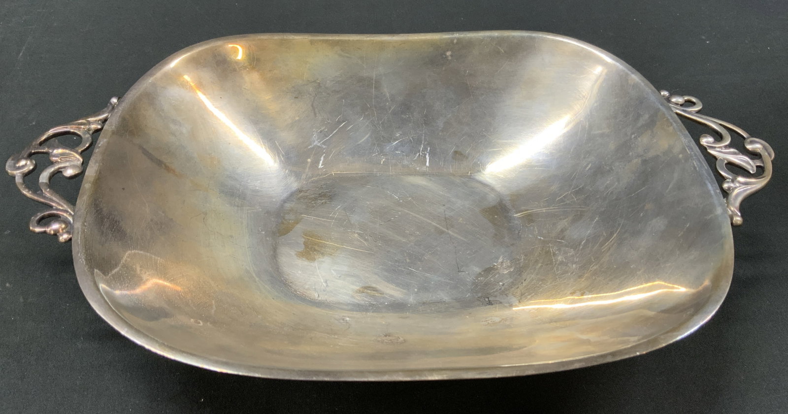 Vtg Silver plated 474 Serving Bowl, Denmark: Vintage Danish silver plated square serving bowl imported by New York firm Eisenberg-Lozano. Asymmetrical curved rim flanked by two openwork scroll accented art nouveau style handles. Underside