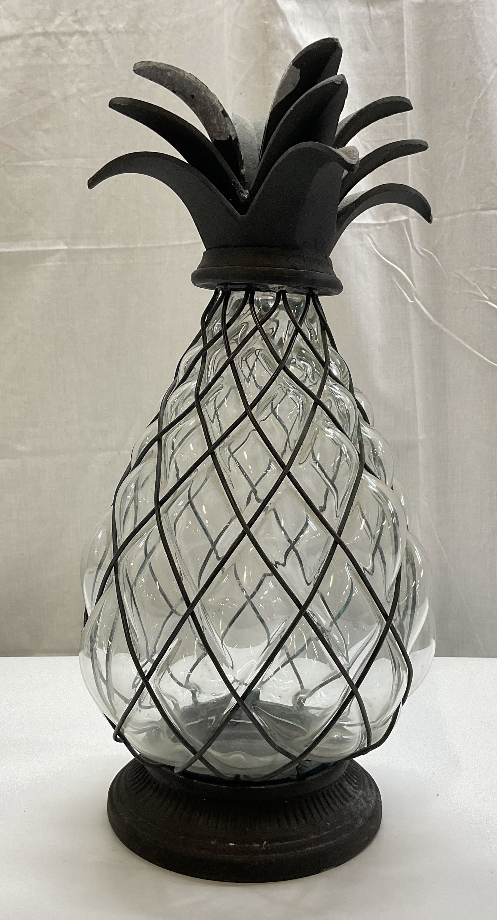 Exhart Metal & Glass Pineapple Lantern: Exhart metal and glass pineapple lantern. Round ribbed metal base, detachable. Detailed leaf top. Diamond like pattern, clear glass body. Shaped like a pineapple. Measures ht approx 18 inches diam