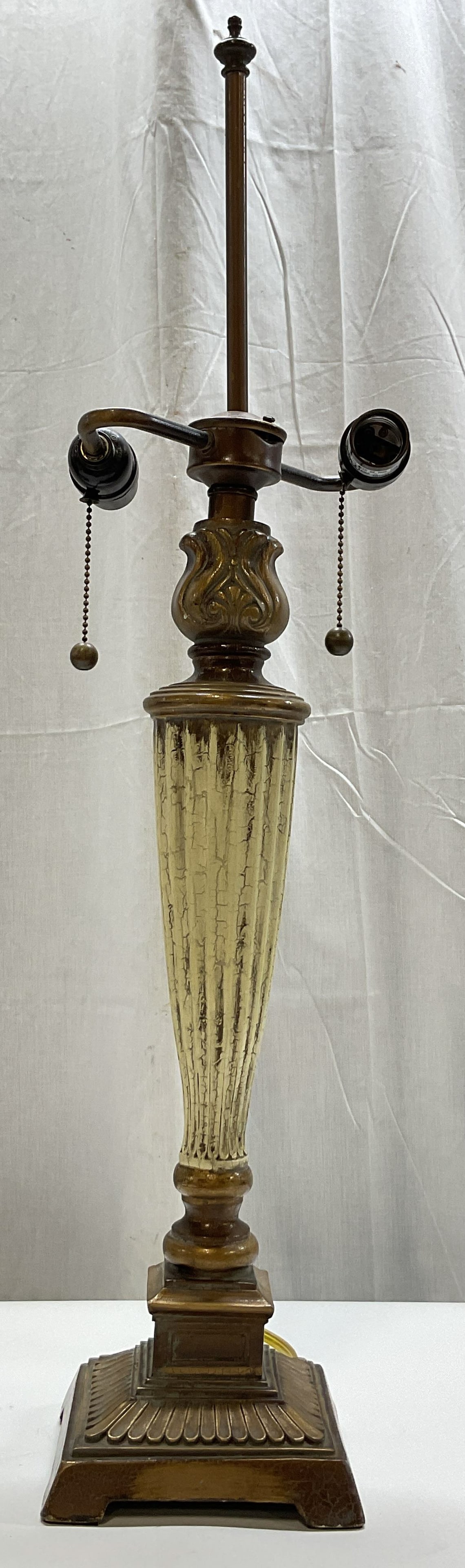 Vintage Neoclassical Style Table Lamp 31.5in: Vintage neoclassical style table lamp. Made of composite. Square footed base with pedestal design. Carved design with ribbed surface. Fluted ribbed cream column with crackle design. Ornate scroll