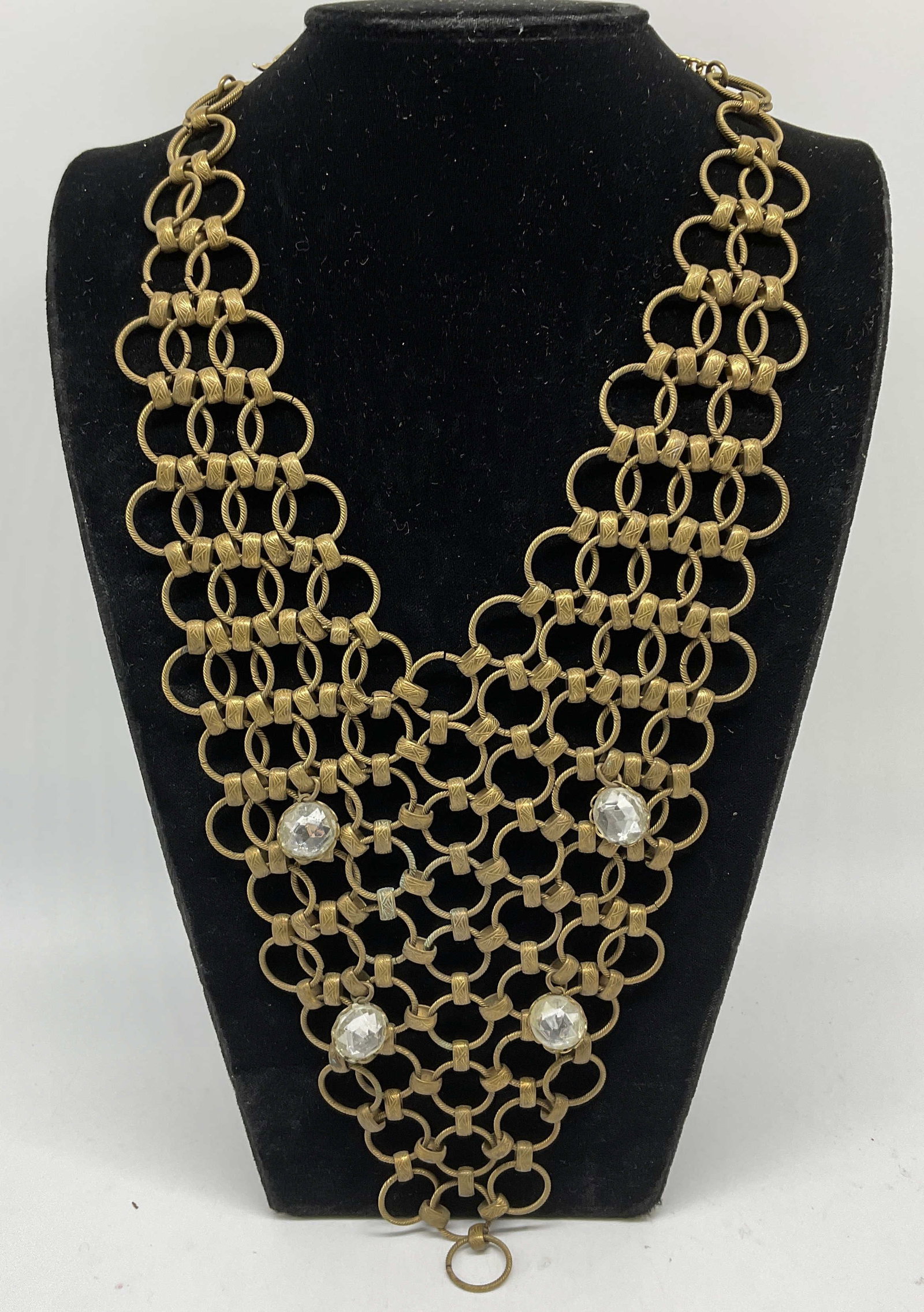 Brass-Toned Chainmail Bib Necklace: Brass-Toned Chainmail Bib Necklace. Clear Rhinestone Accents. Condition consistent with age and exposure. Measures approx 19in L. brass-toned, chainmail, links, bib necklace, rhinestones, jewelry 8 J