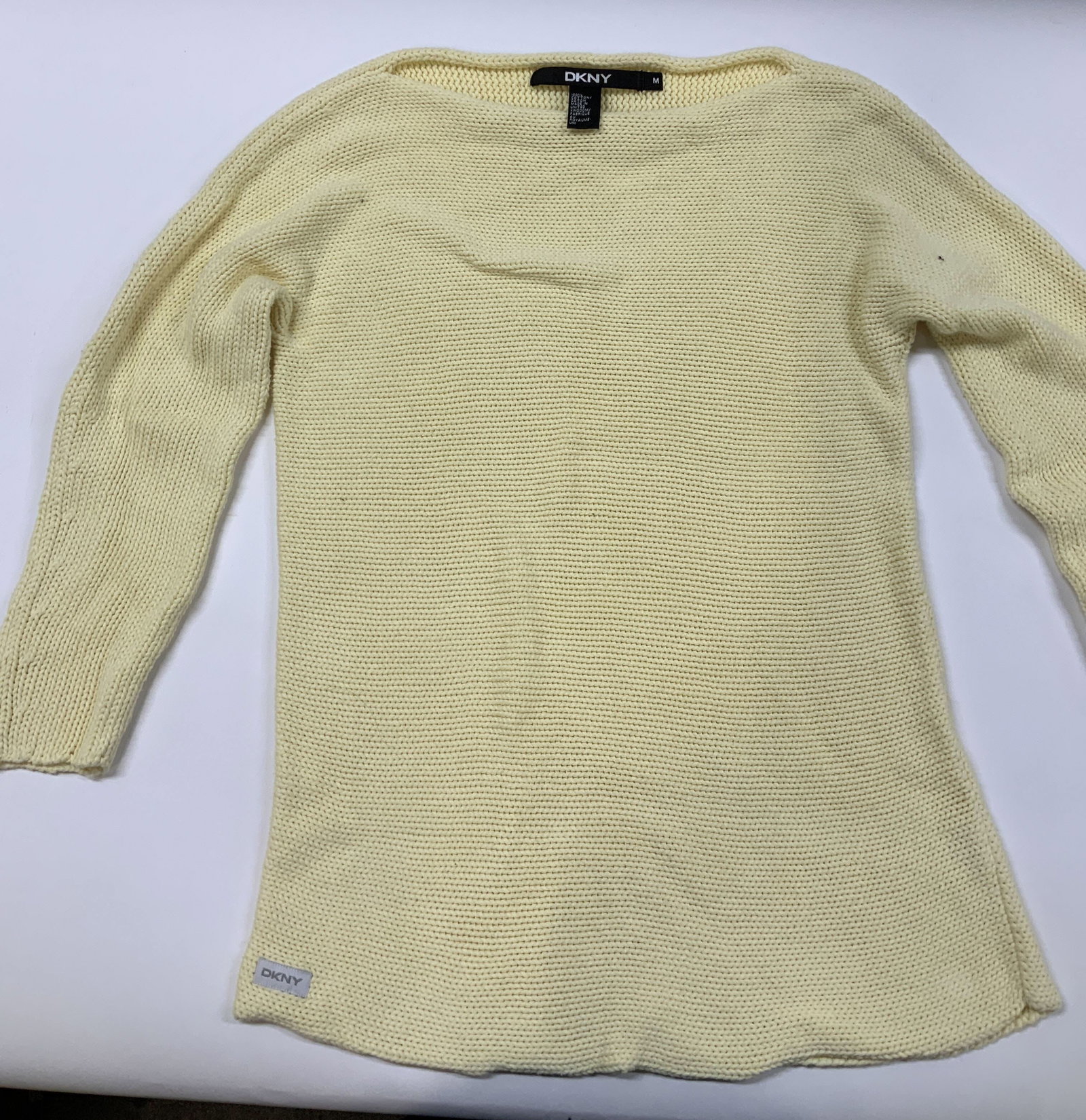 Vntg DKNY yellow cotton sweater, United Kingdom: Vintage DKNY yellow sweater. Made if 100% cotton in the United Kingdom in size Medium. Designed with a flattering boatneck neckline and ribbed knit. Sweater, boatneck, yellow H 11